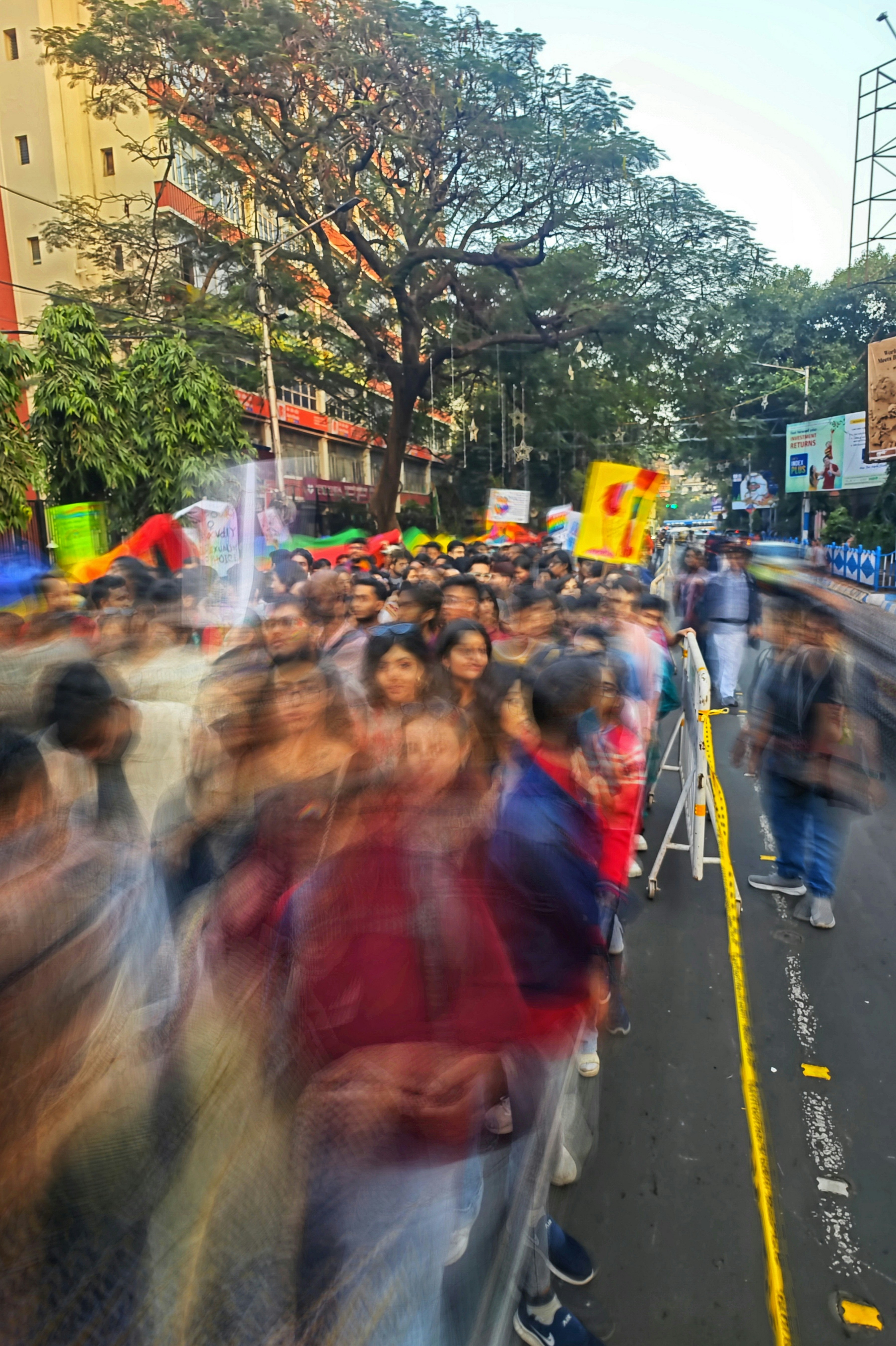 A large group of people walking down a street