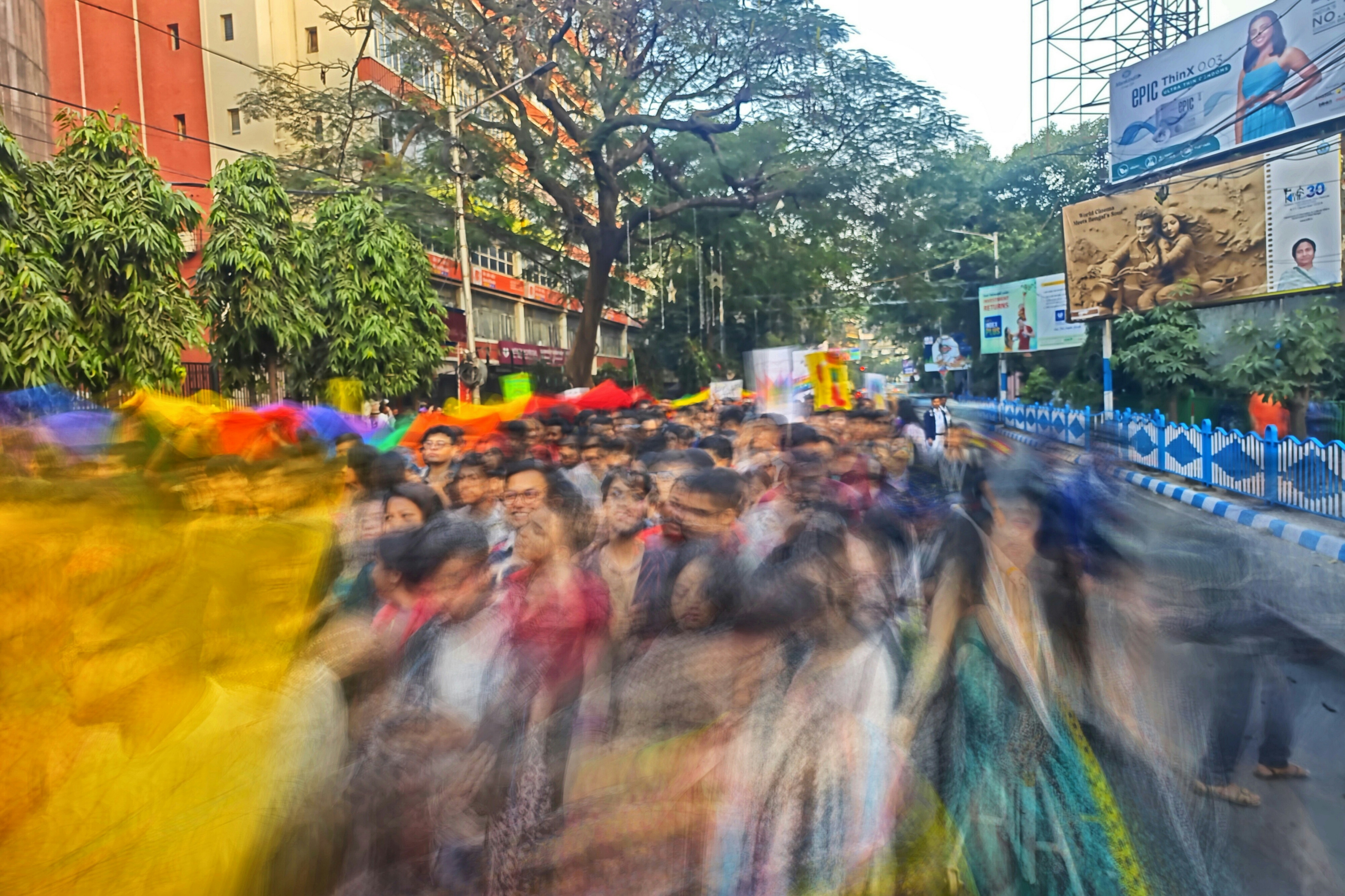 A large group of people walking down a street