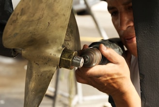 A man is working on a piece of metal