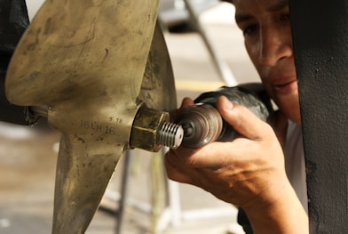 A man is working on a piece of metal