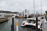 A boat docked at a dock in a harbor
