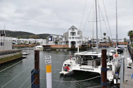 A boat docked at a dock in a harbor