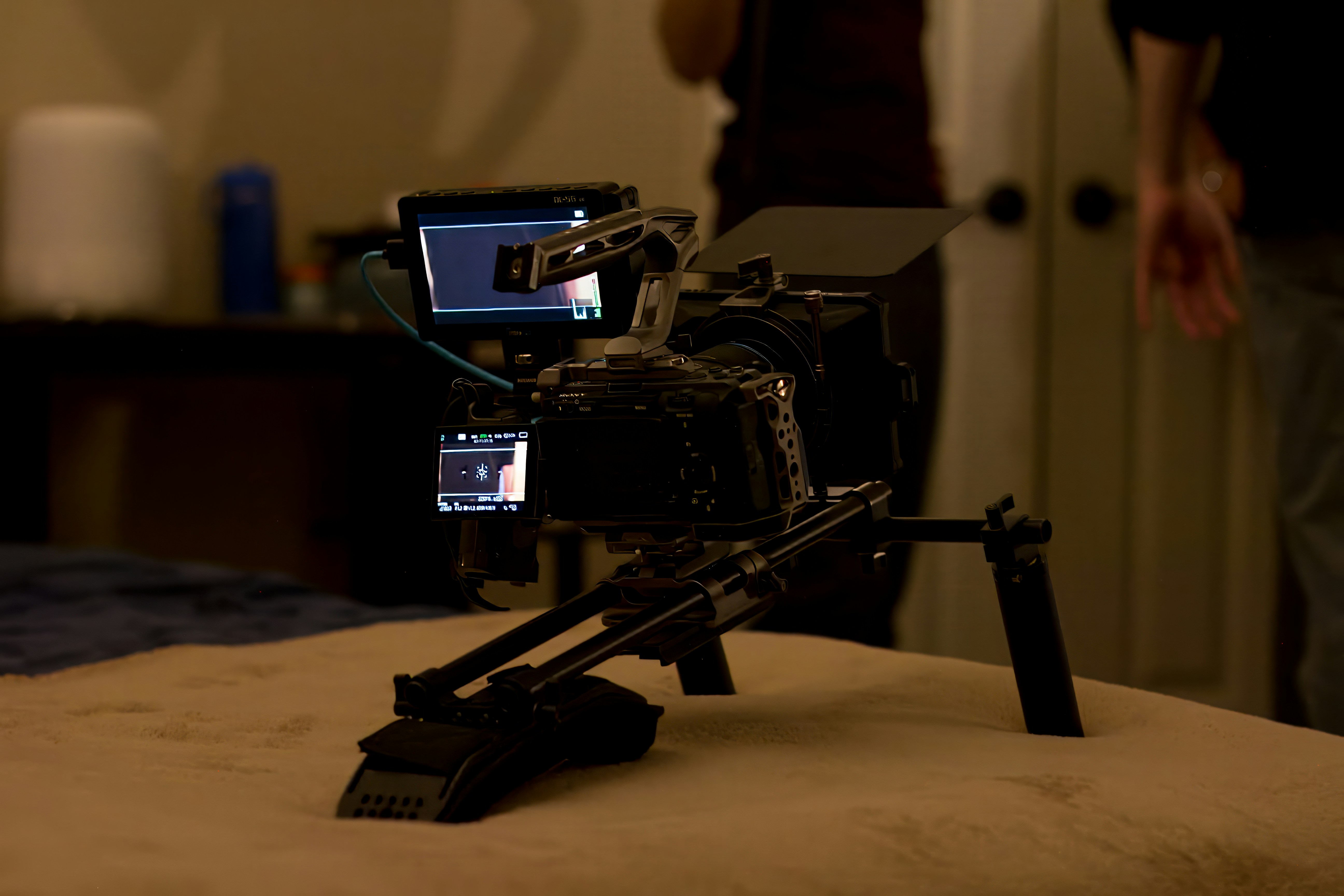 A video camera sitting on top of a bed