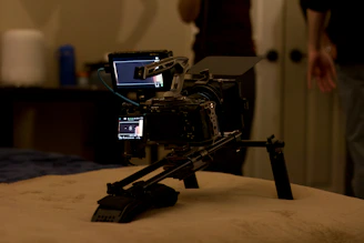 A video camera sitting on top of a bed