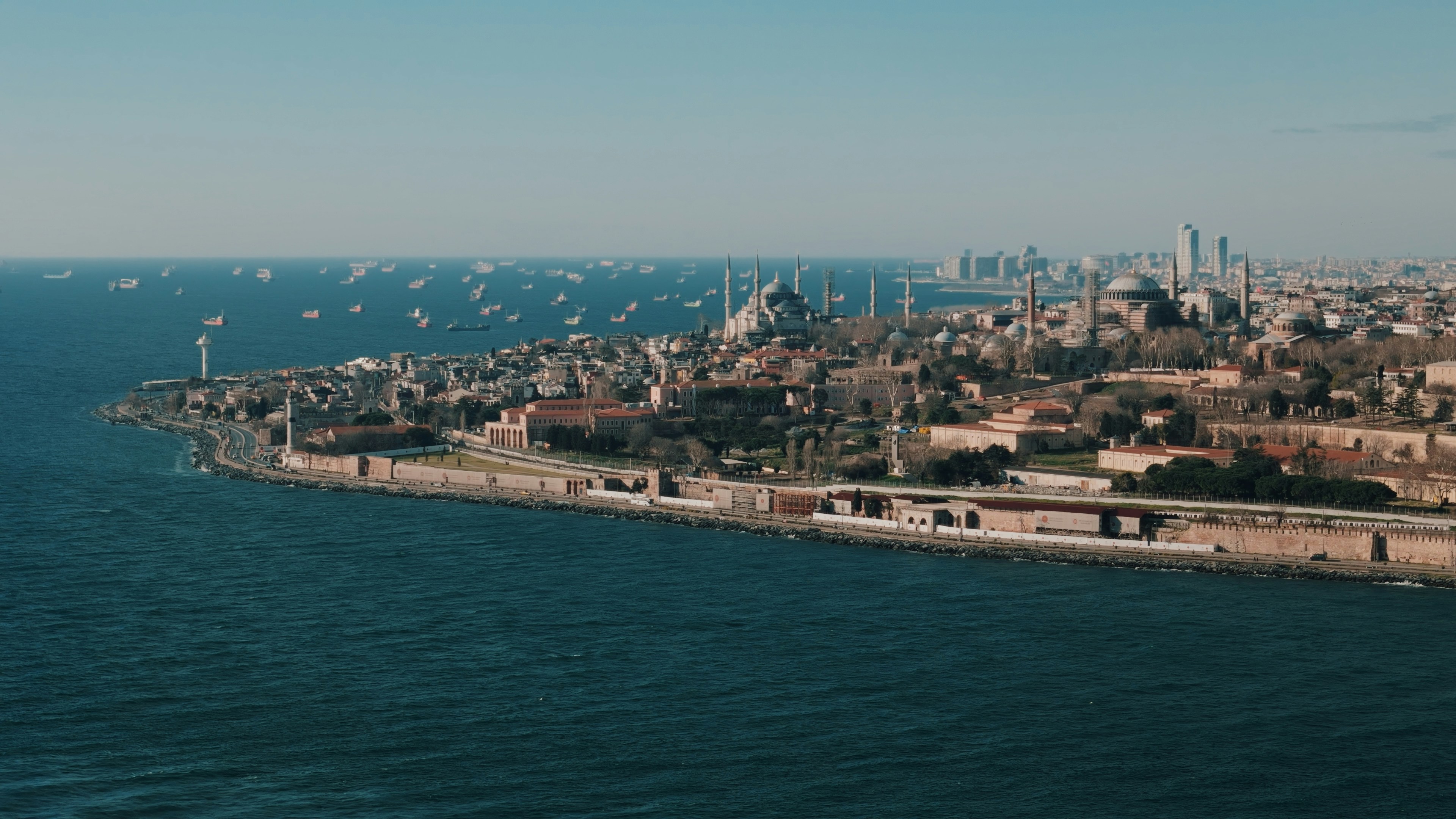 A large body of water with a city in the background