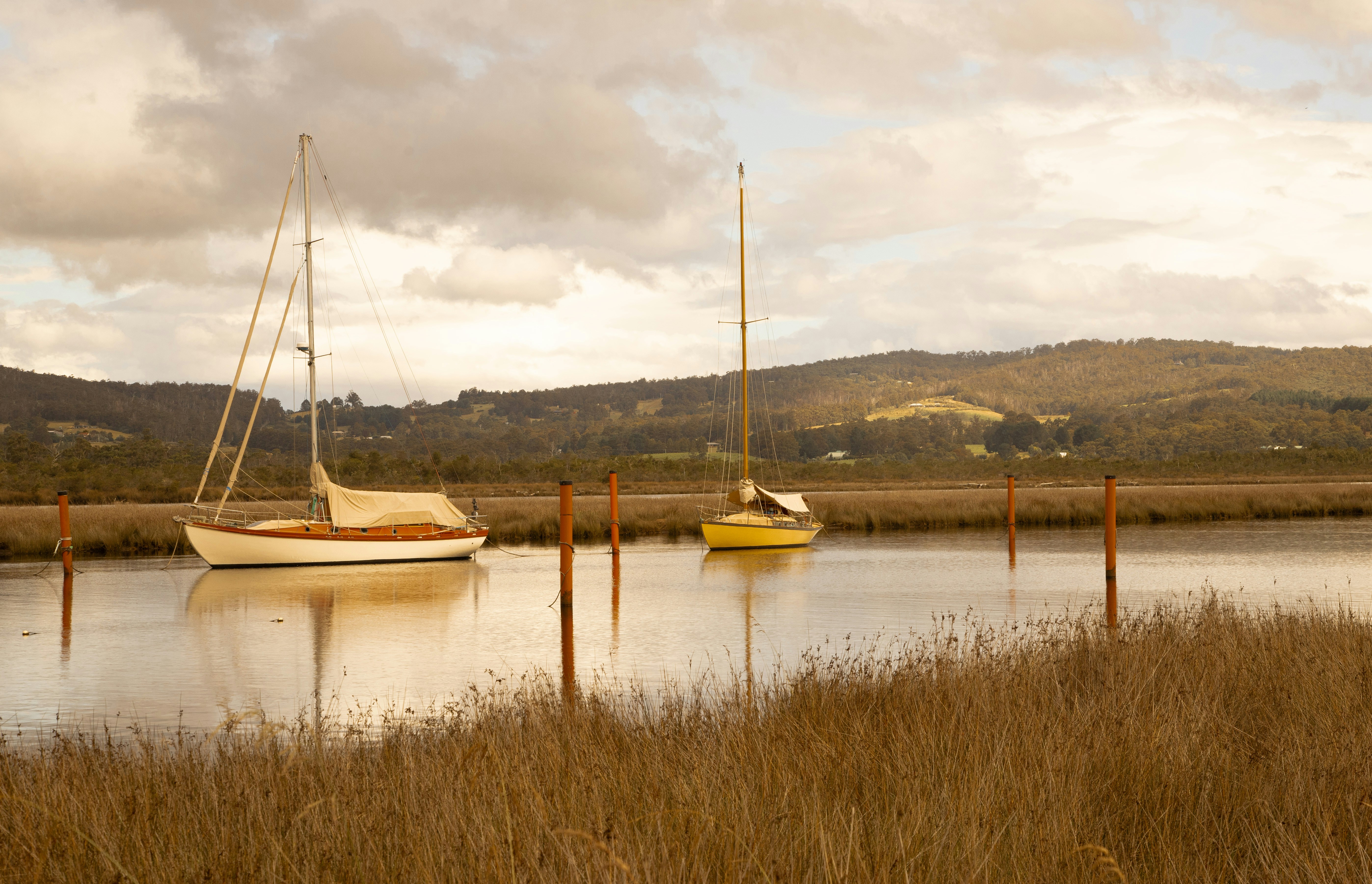 A couple of boats that are sitting in the water