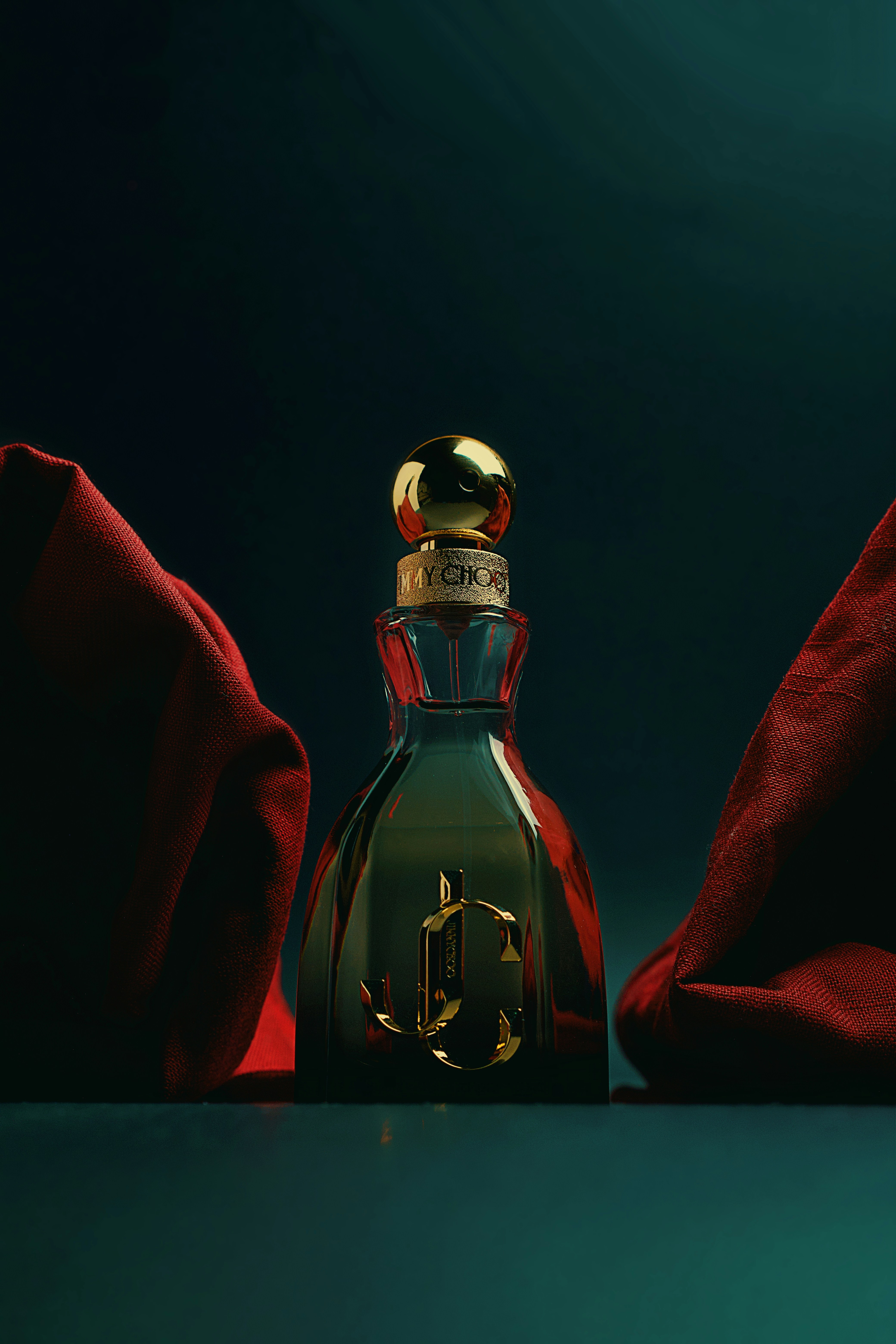 A bottle of perfume sitting on top of a table