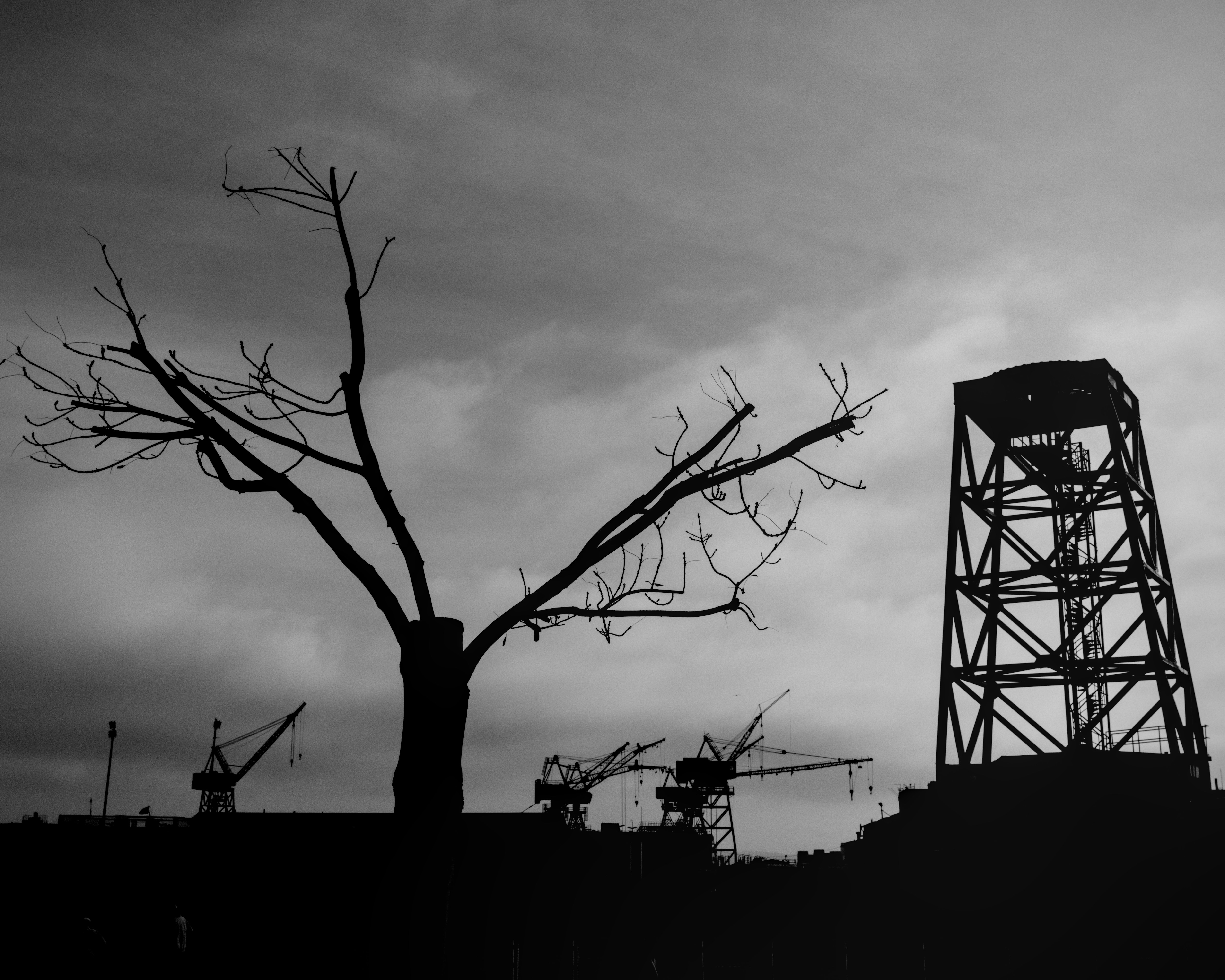A black and white photo of a water tower
