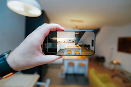A person taking a picture of a living room