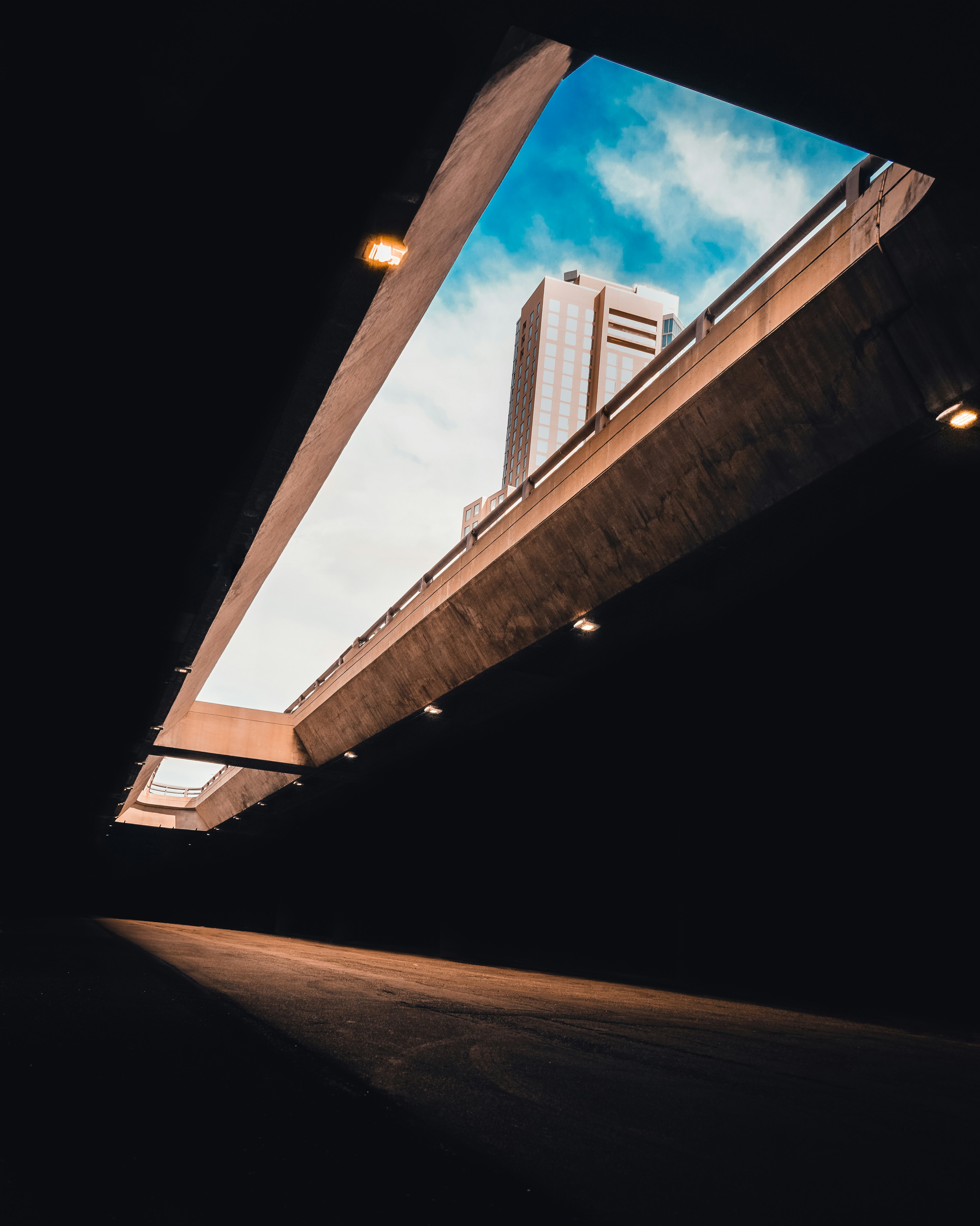 A dark tunnel with a skylight above it
