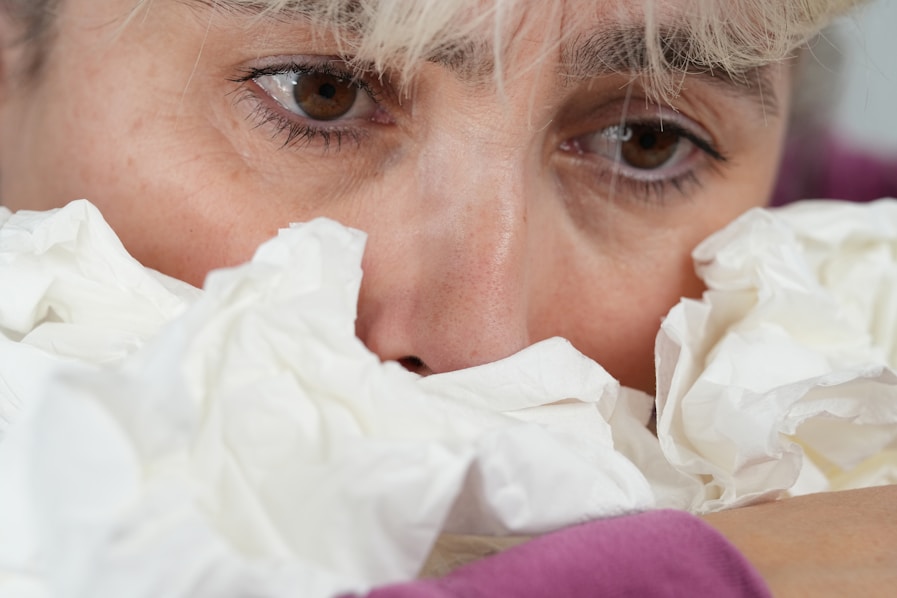 A close up of a person covering their face