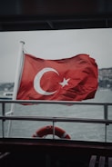 A flag on a boat in the water