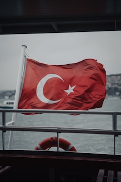 A flag on a boat in the water