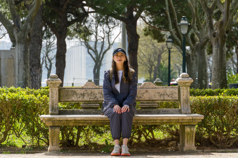 woman sitting on a bench in the park