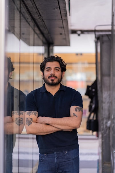 A man standing in front of a glass door