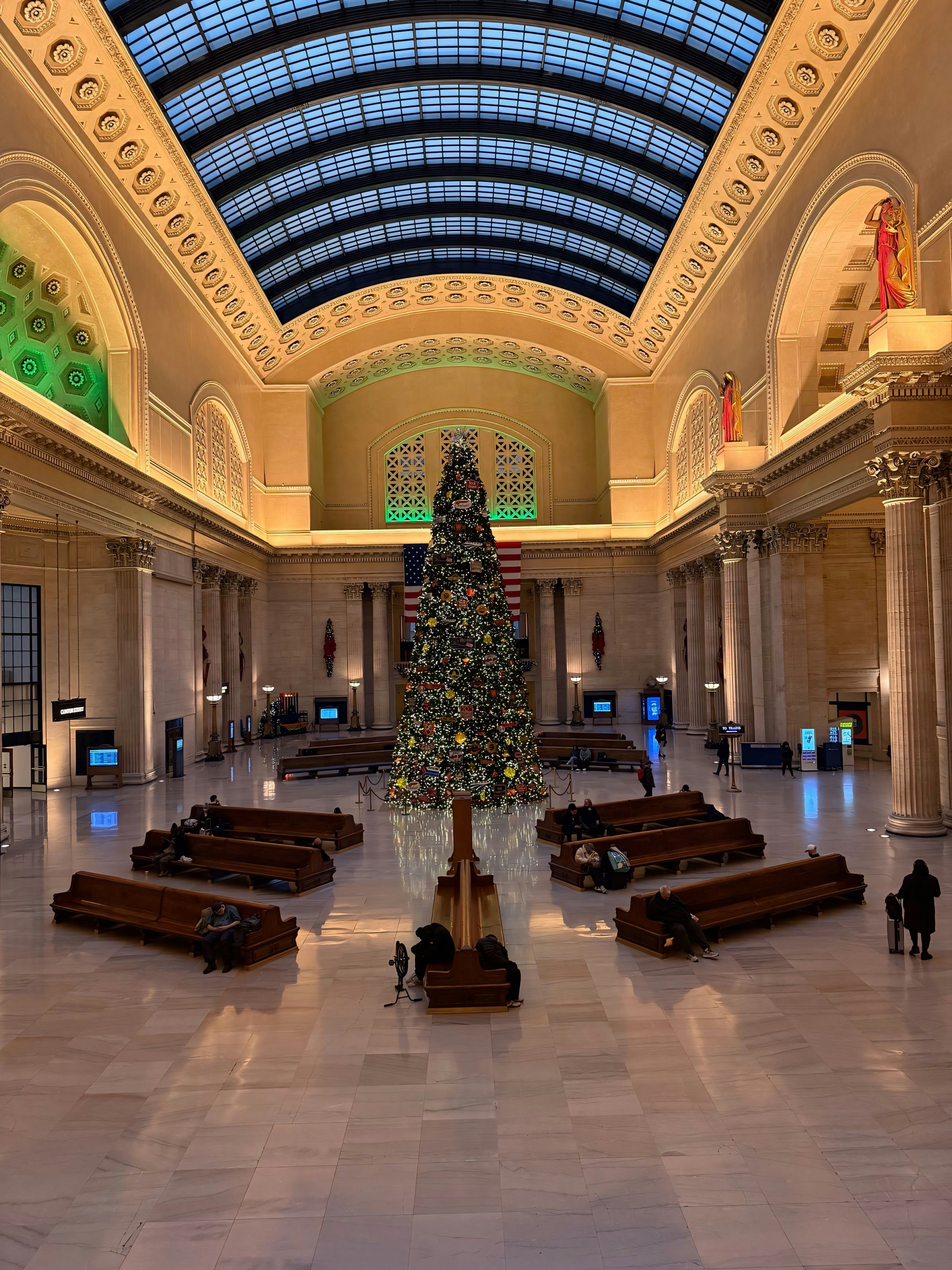A large building with a christmas tree in the middle of it
