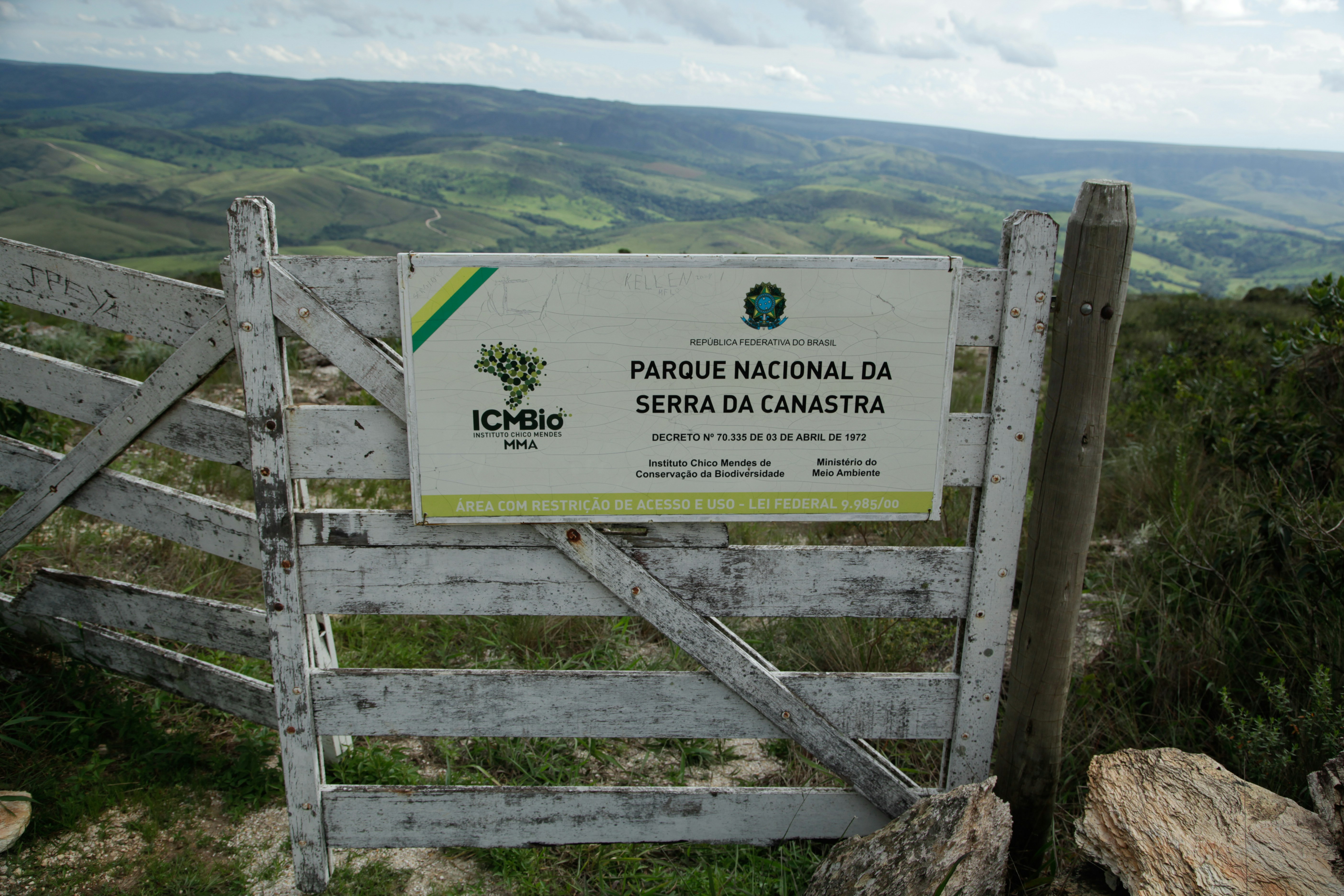 A wooden gate on top of a mountain