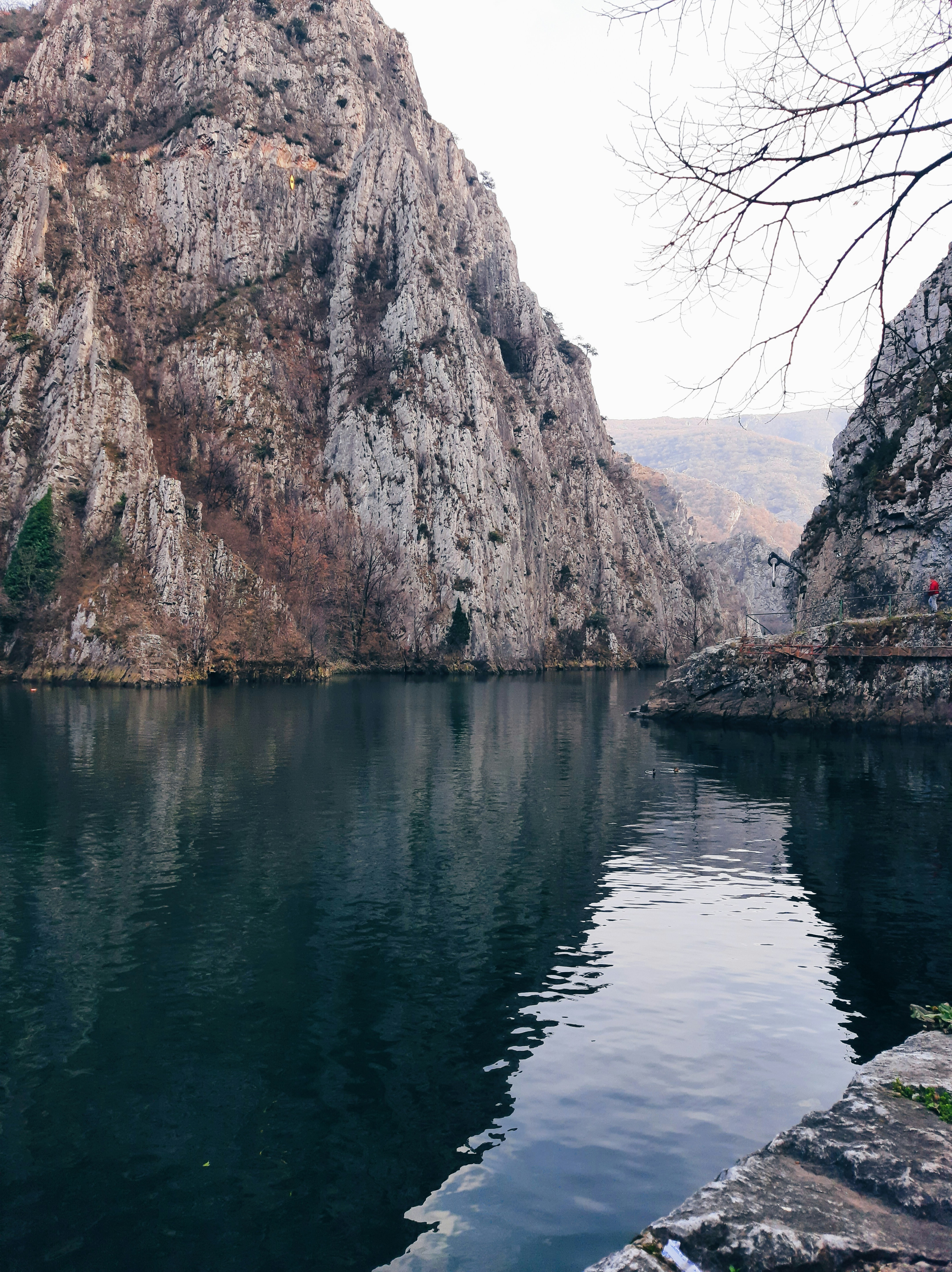 A large body of water surrounded by mountains