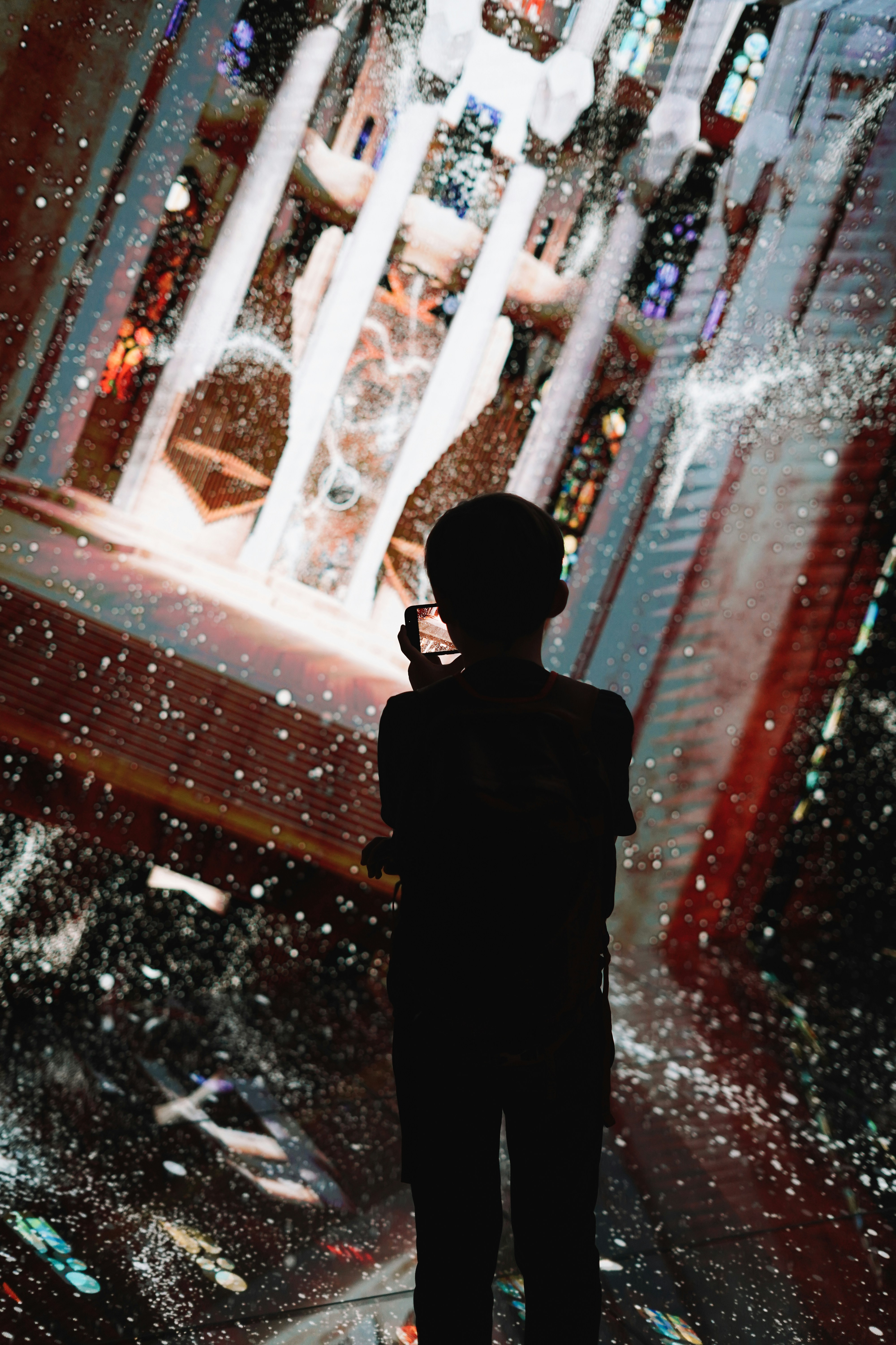 A person standing in front of a fountain