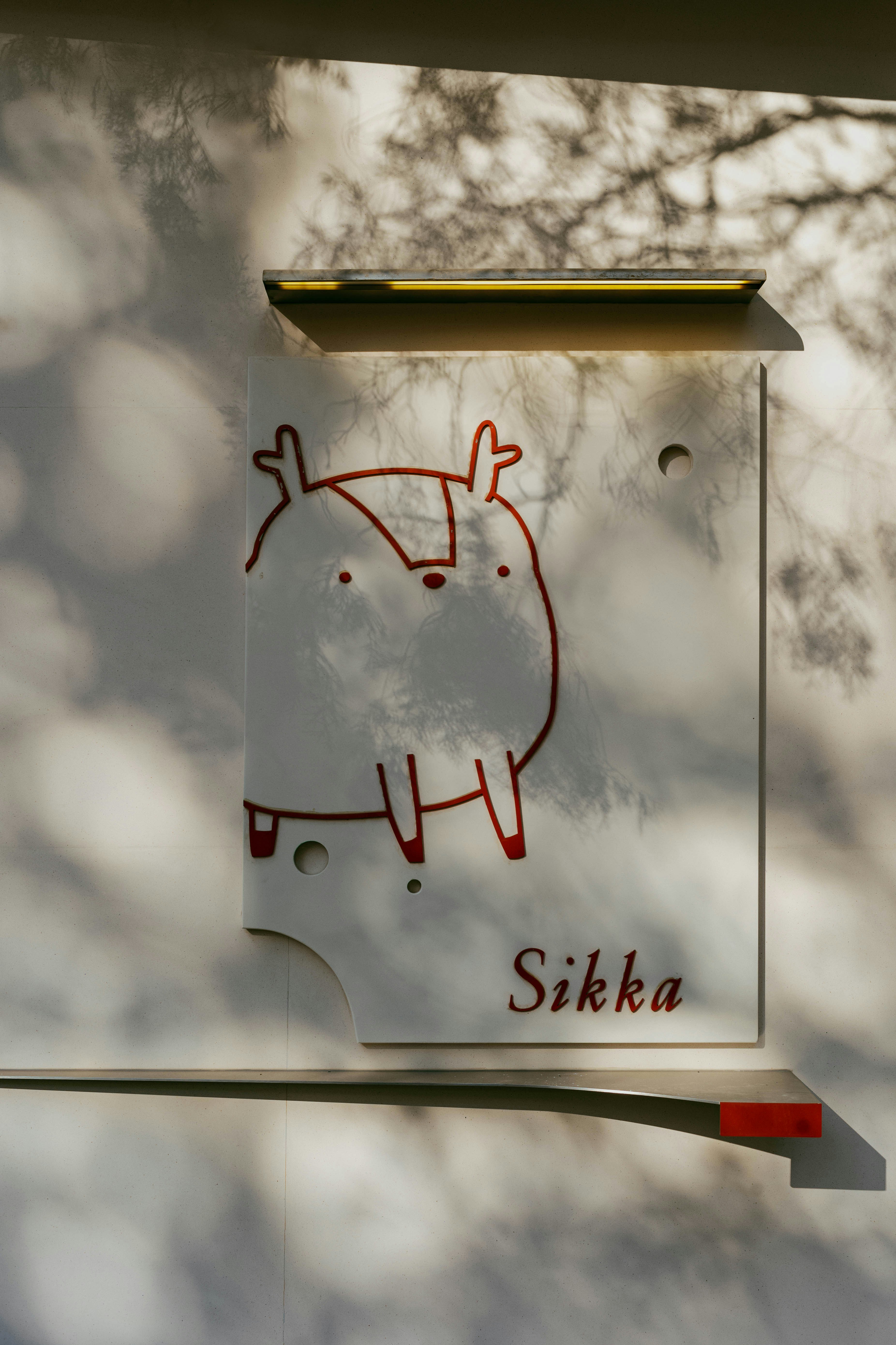 A sign with a picture of a cartoon character on it photo – Free Winter ...