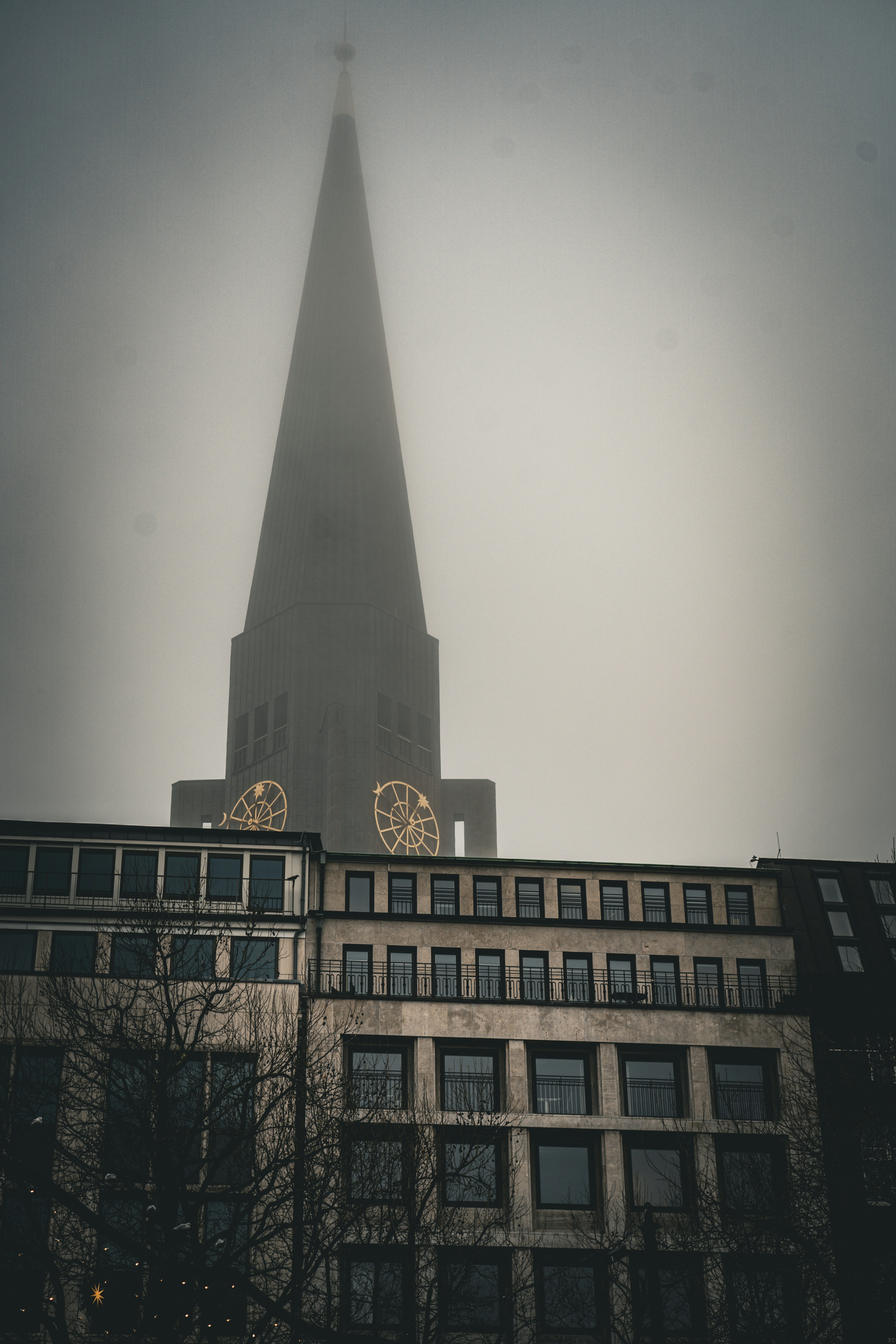 A very tall building with a clock on it's side