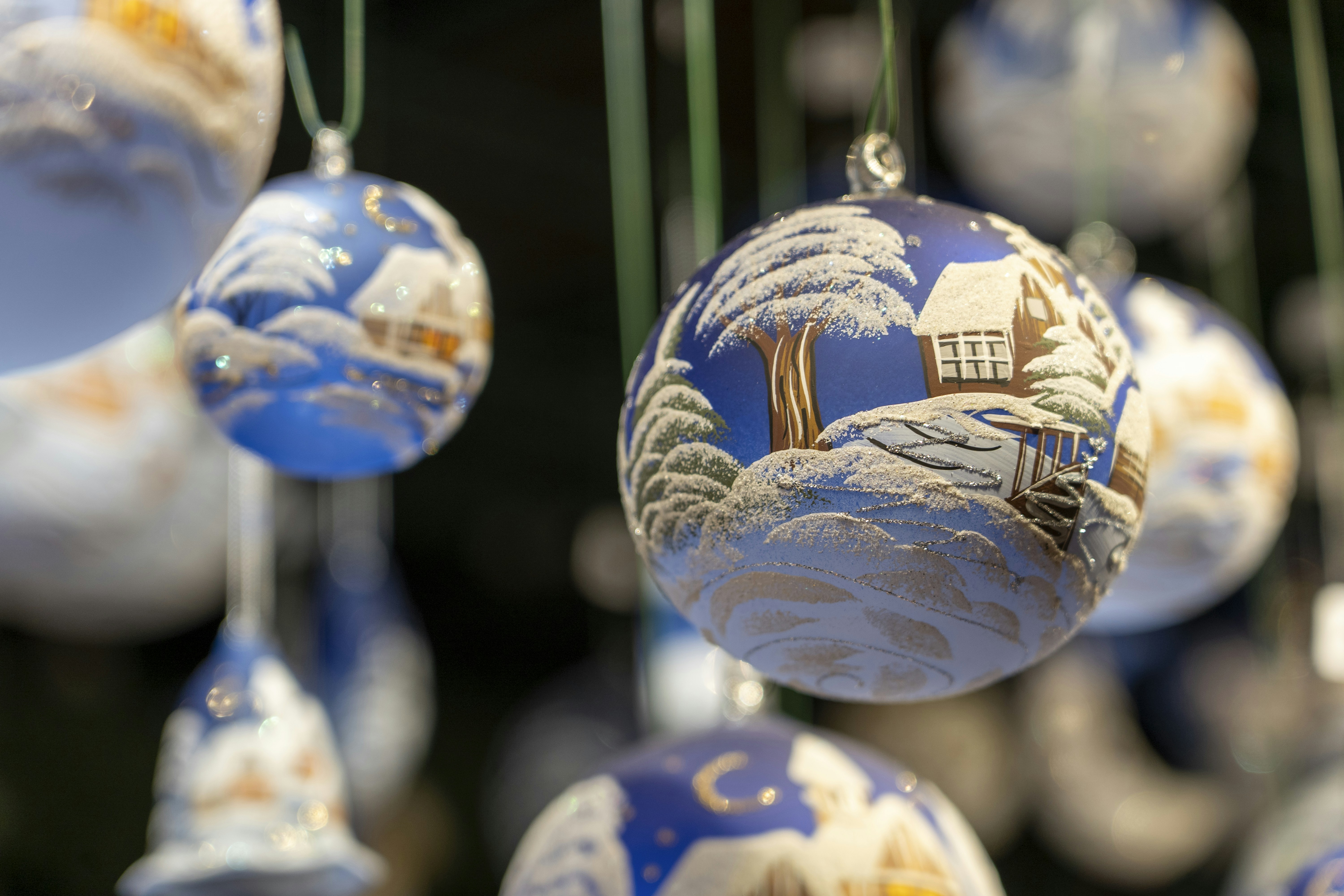 A bunch of ornaments hanging from a ceiling