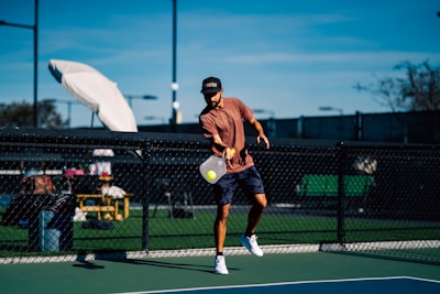 A man on a tennis court holding a tennis racket