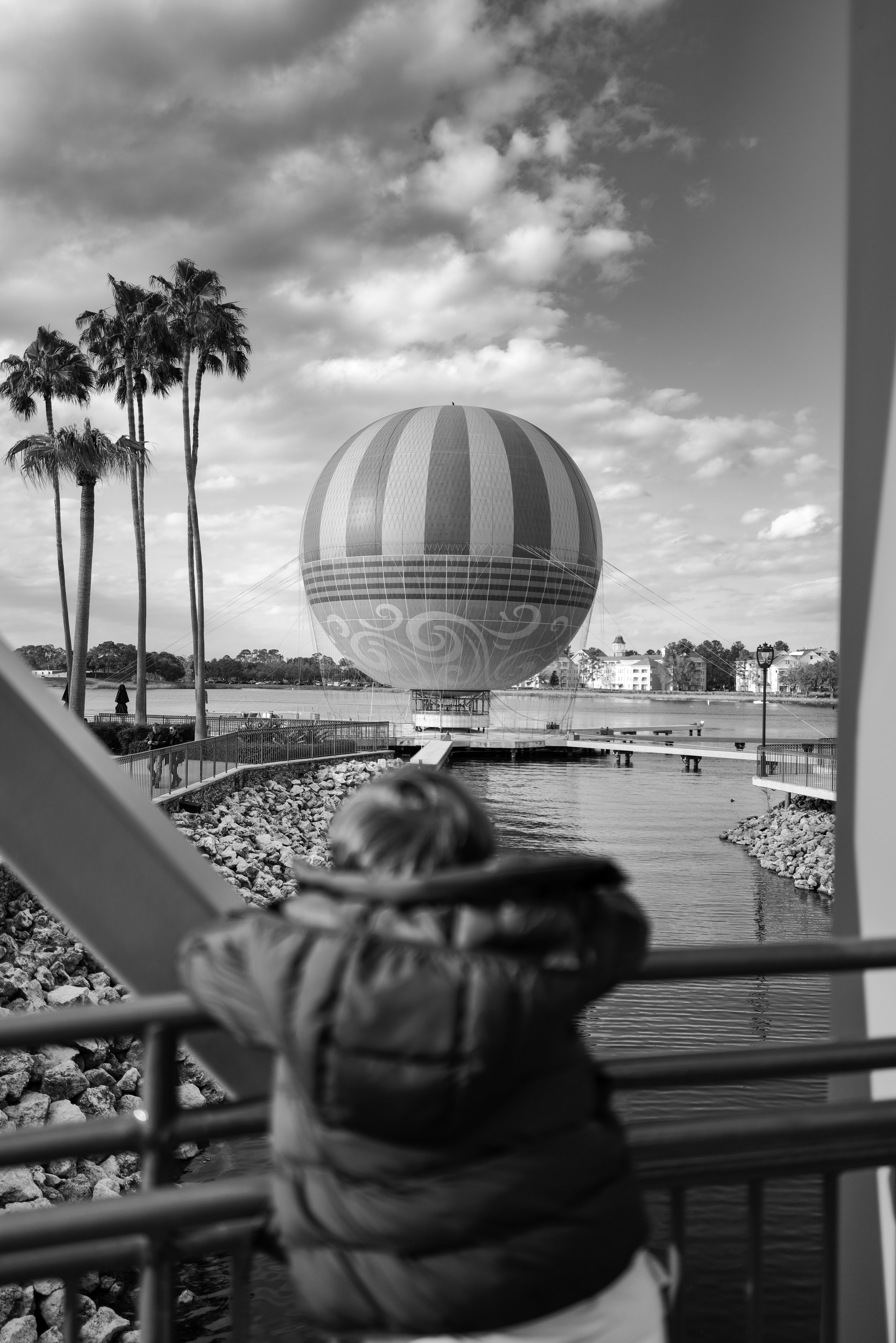 A person looking at a hot air balloon