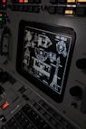 The control panel of a plane with a lot of buttons