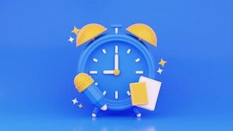 A blue alarm clock with a yellow face