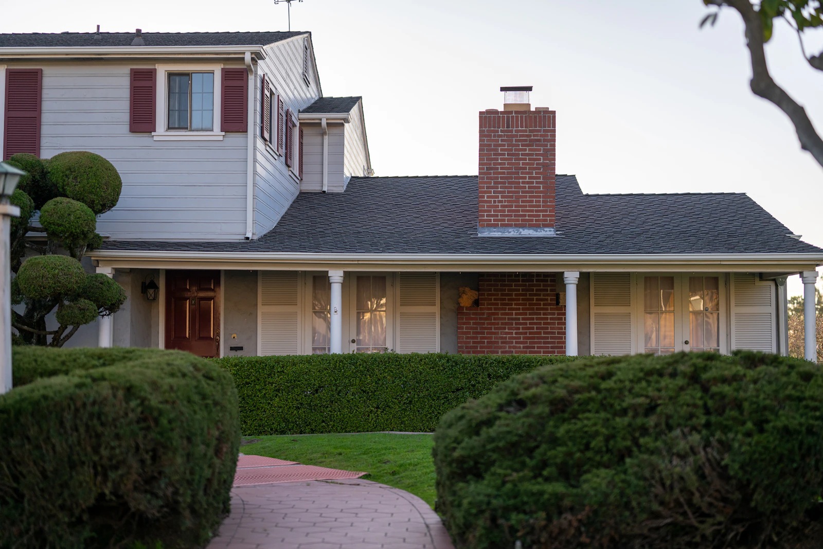 White two-story home with red shutters and a red front door, Fontenaix, Naperville IL