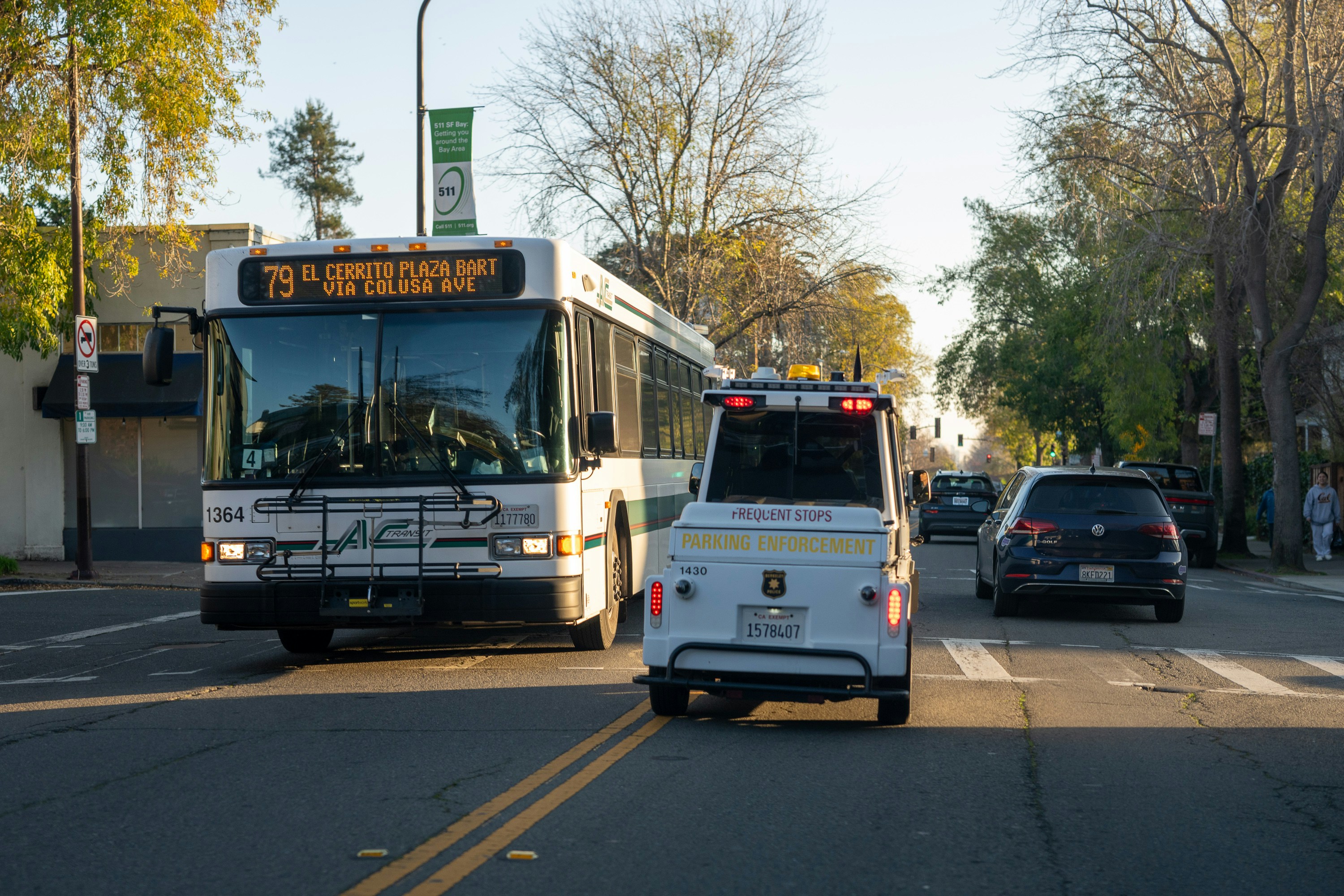 A bus and a car on a city street