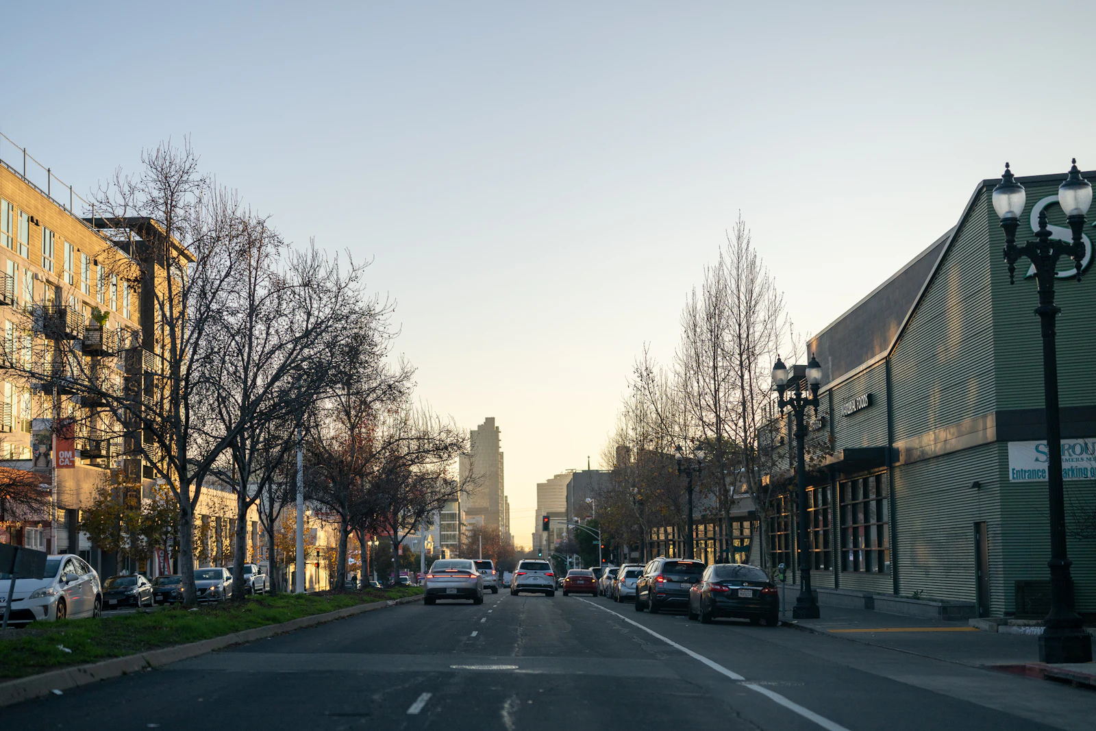A busy city street between tall buildings.