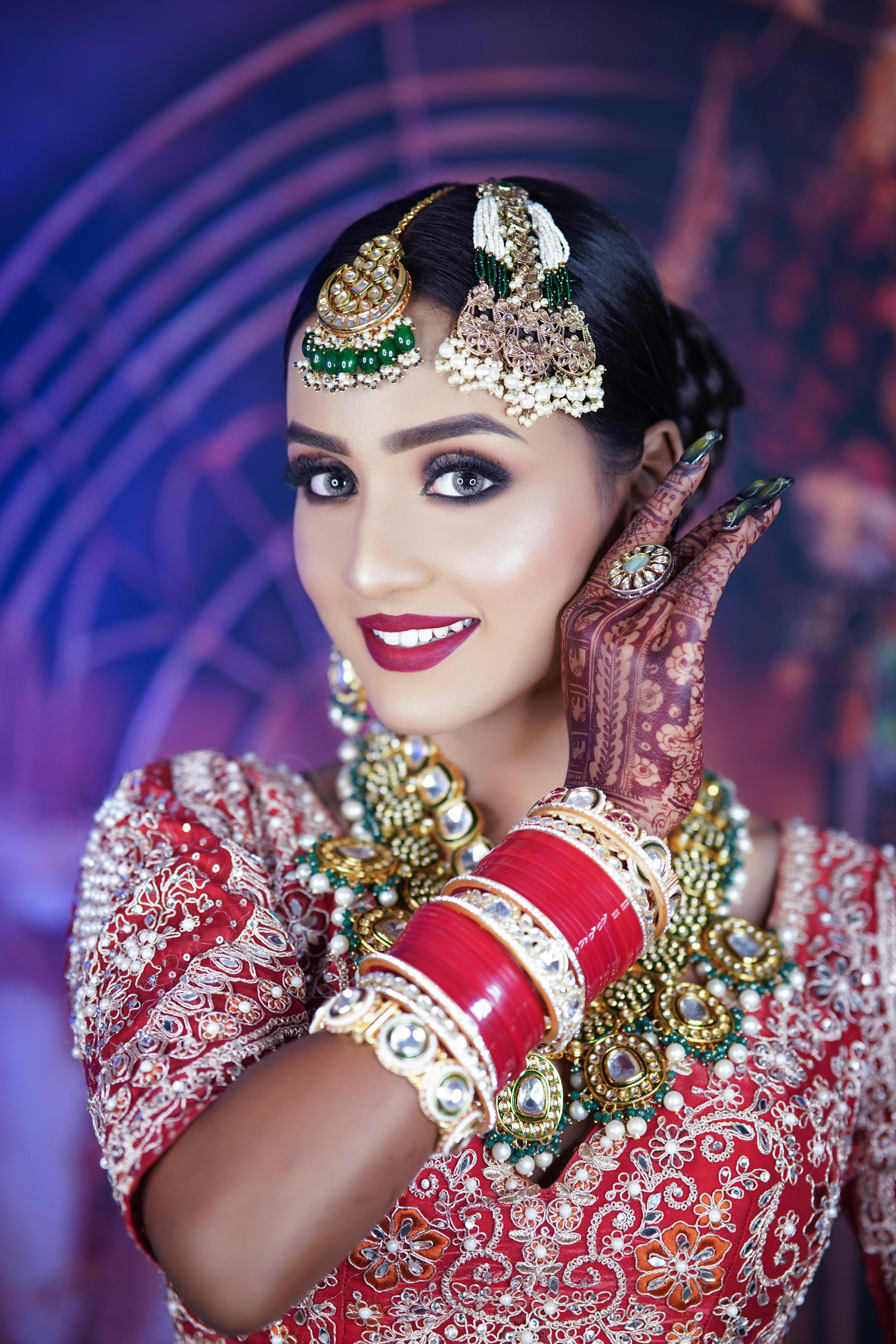 A woman wearing a red and gold outfit
