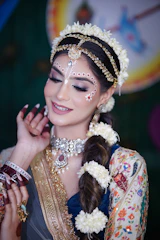A woman wearing a head piece and jewelry