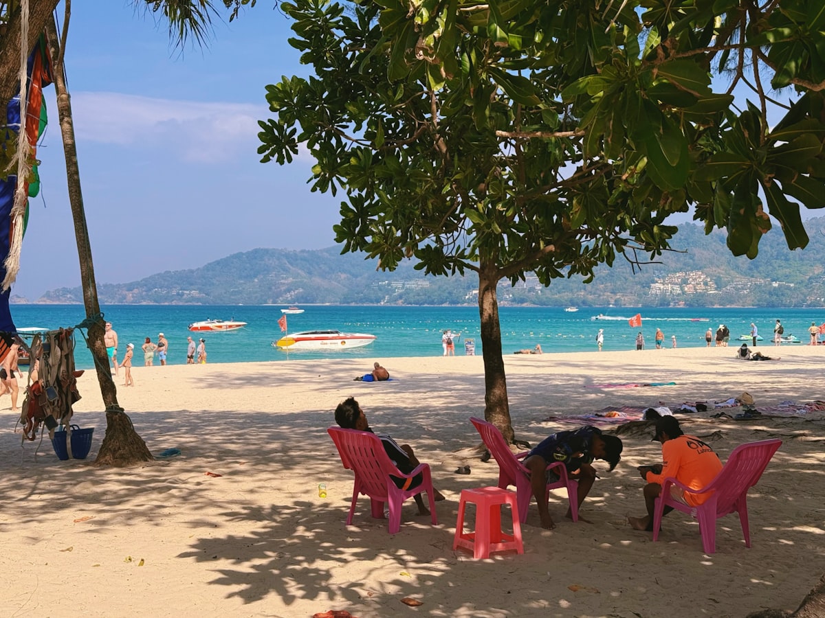Patong Beach Phuket — aerial view of the busy beach with rows of sun loungers and the town behind