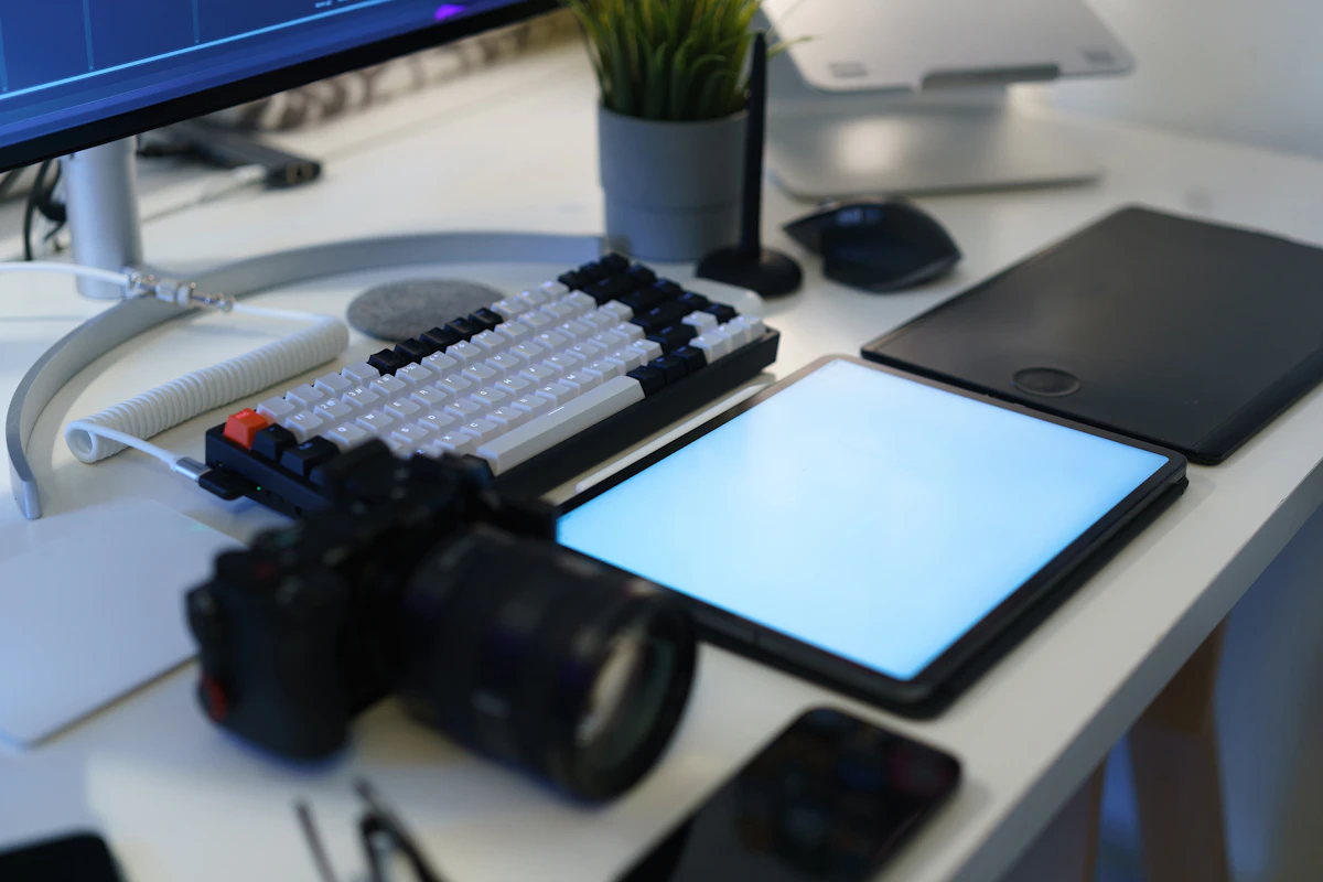 Desk with tablet, keyboard, and monitor showing a setup for practicing design tutorials daily