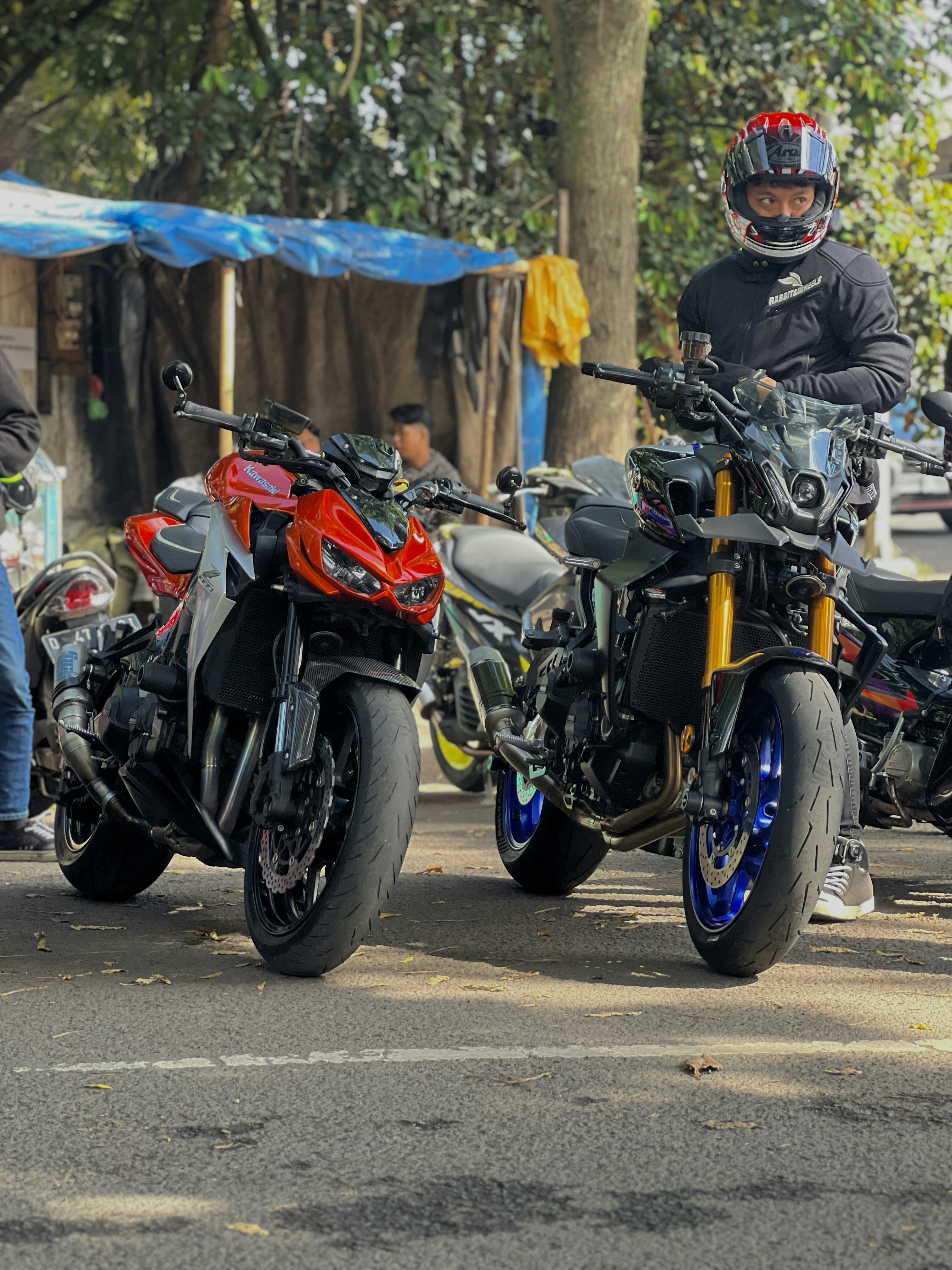 A group of motorcycles parked next to each other