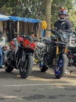 A group of motorcycles parked next to each other