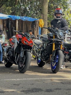 A group of motorcycles parked next to each other