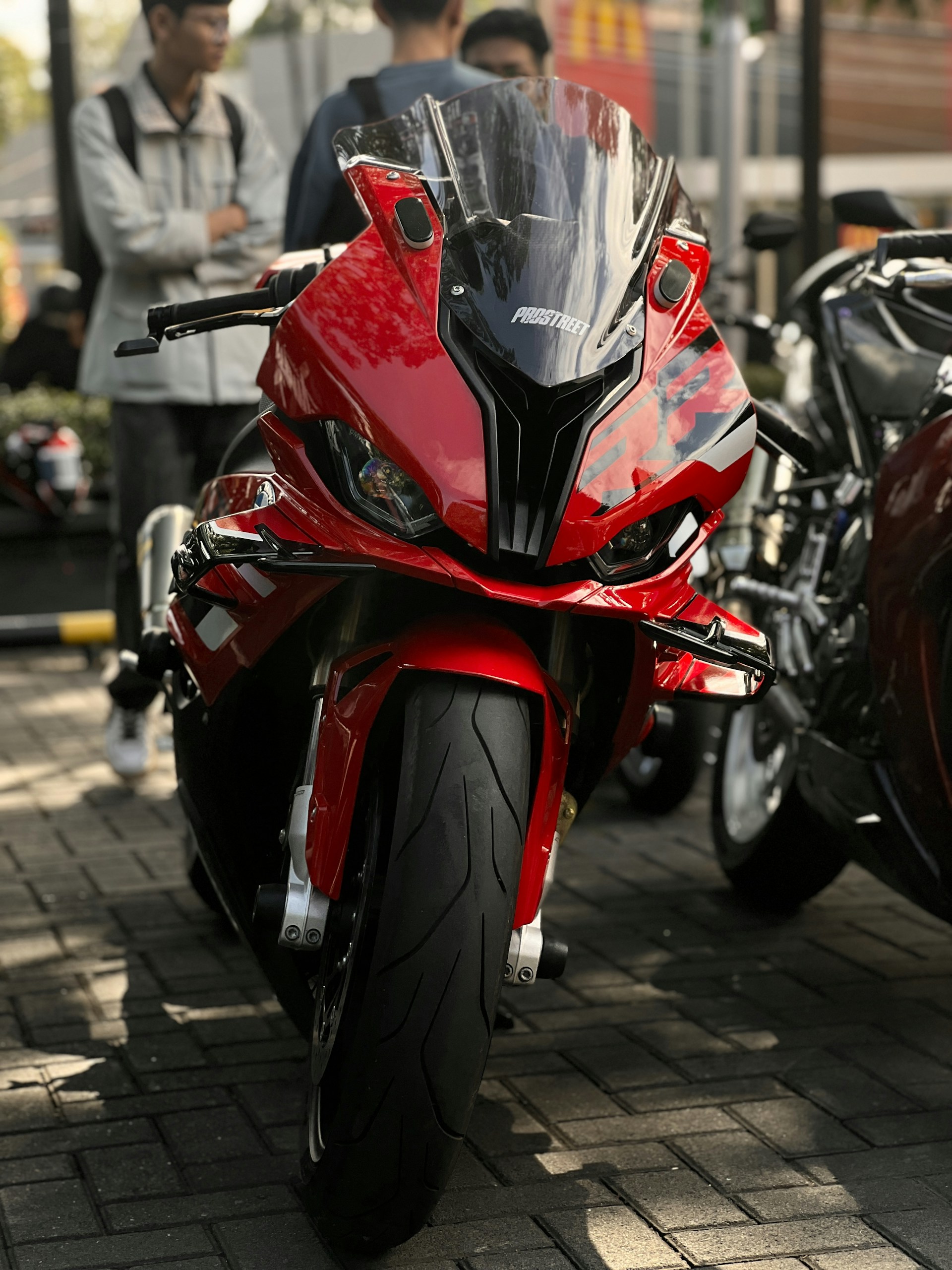 A red motorcycle parked next to a red motorcycle