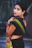 A woman in a black and yellow sari