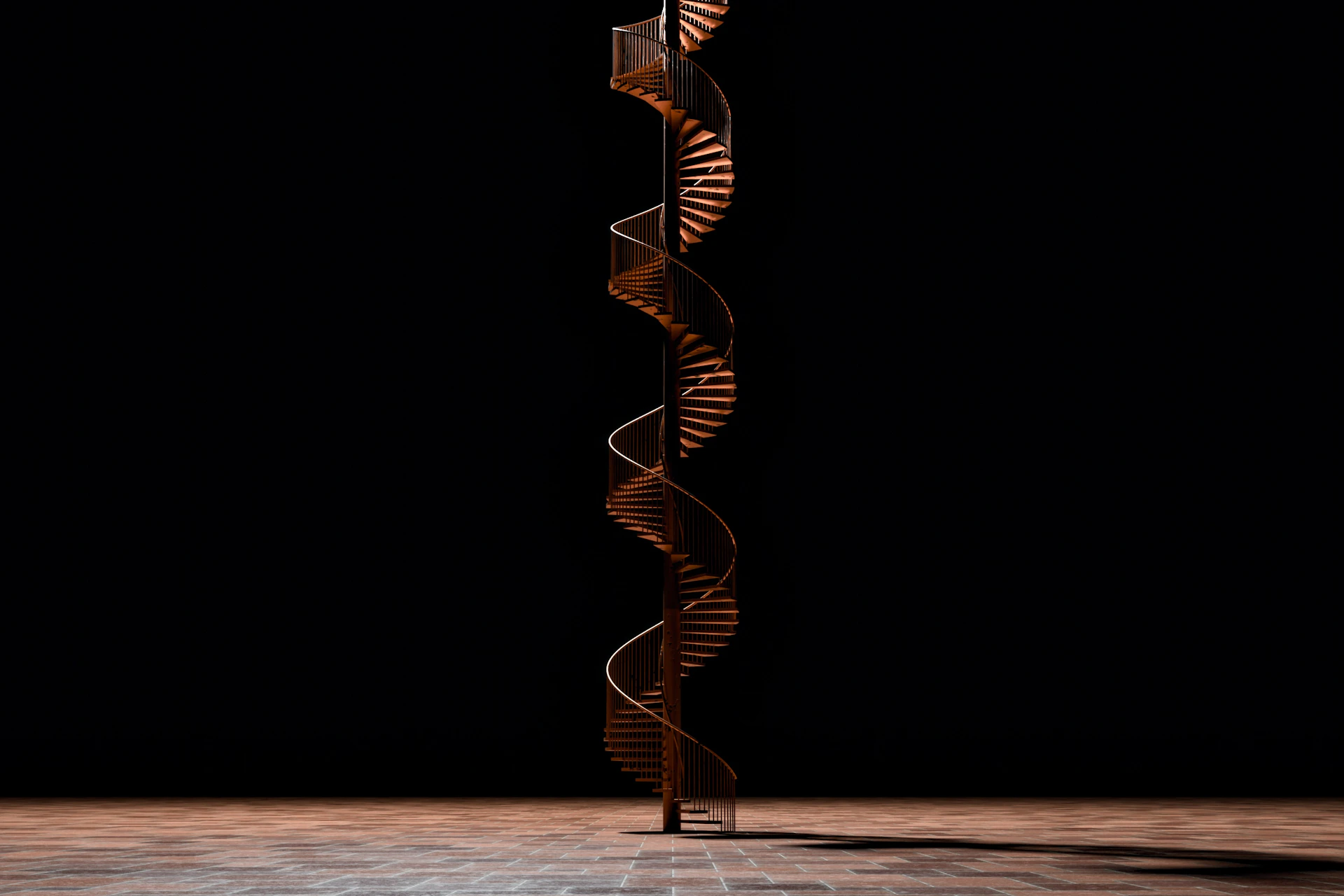 A tall metal spiral on top of a wooden floor