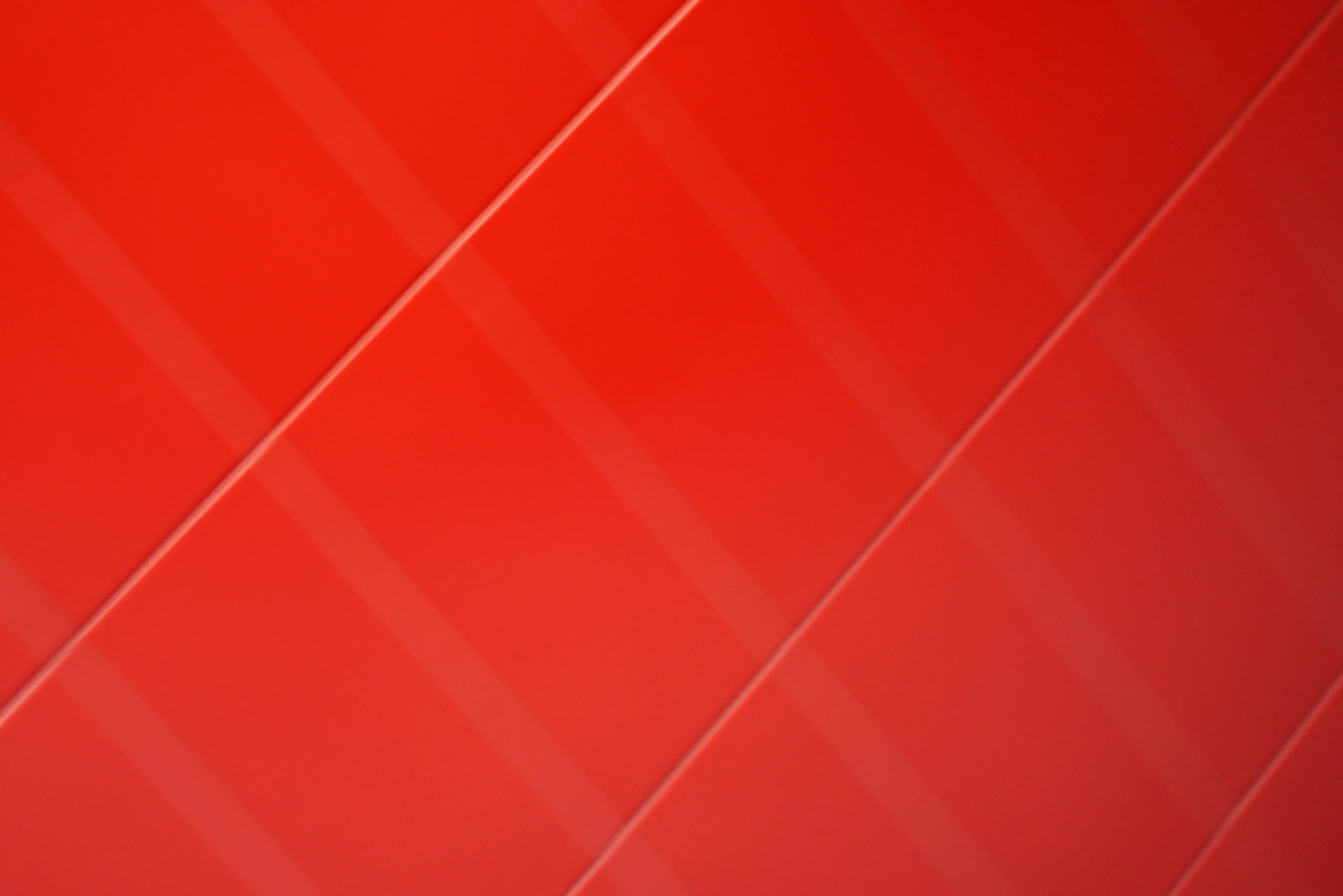 A red background with diagonal lines