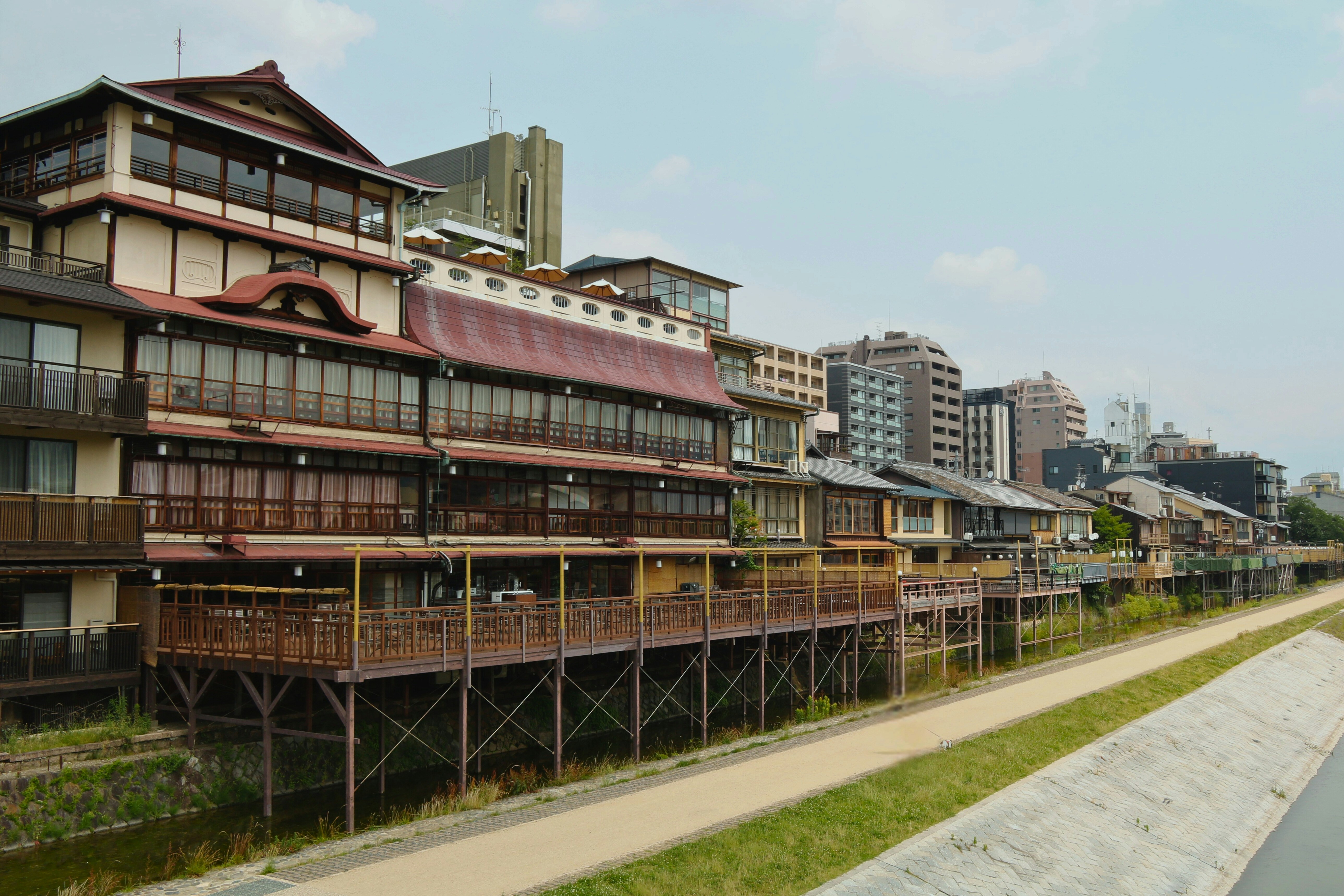 A row of buildings next to a body of water