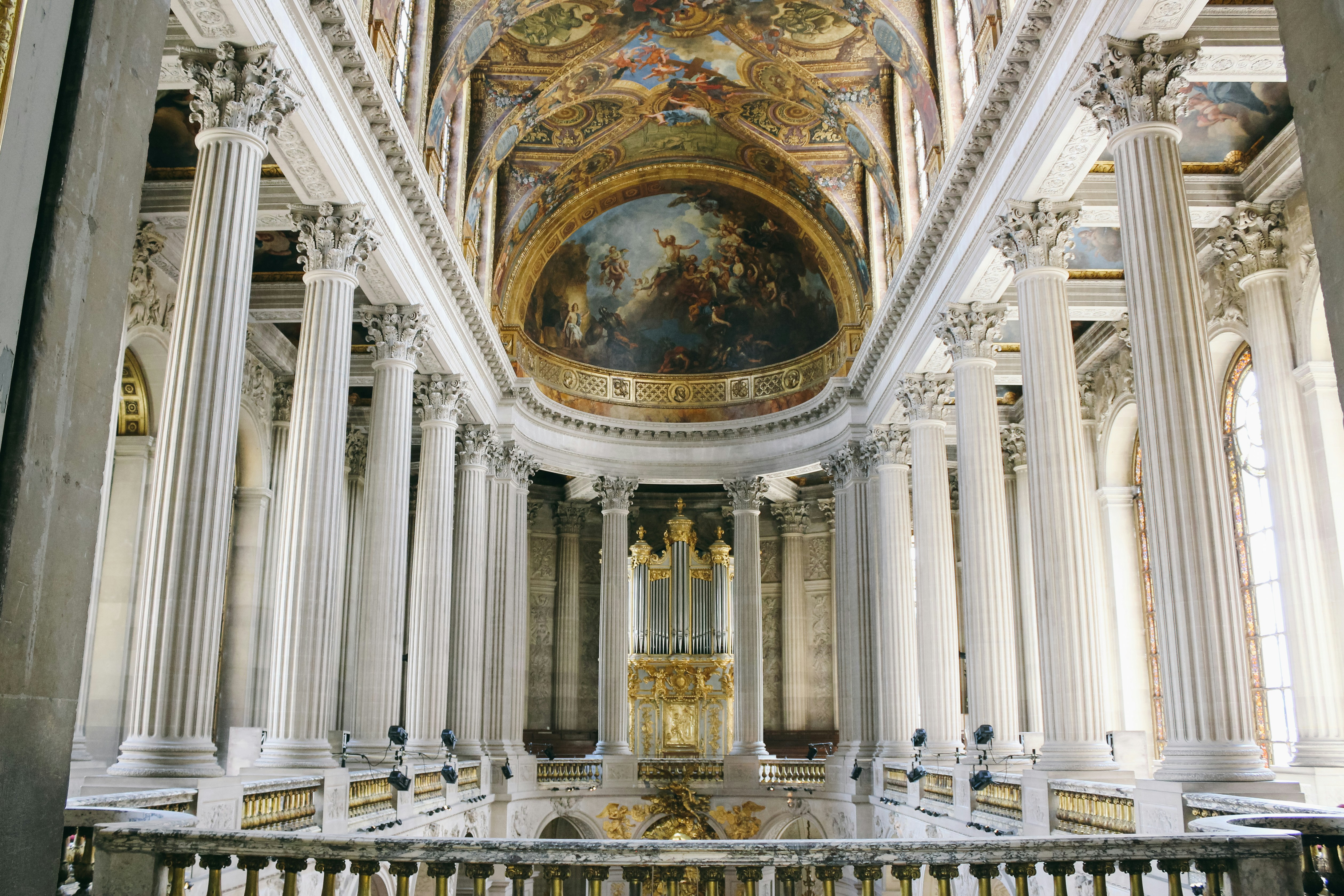 A large cathedral with a painting on the ceiling
