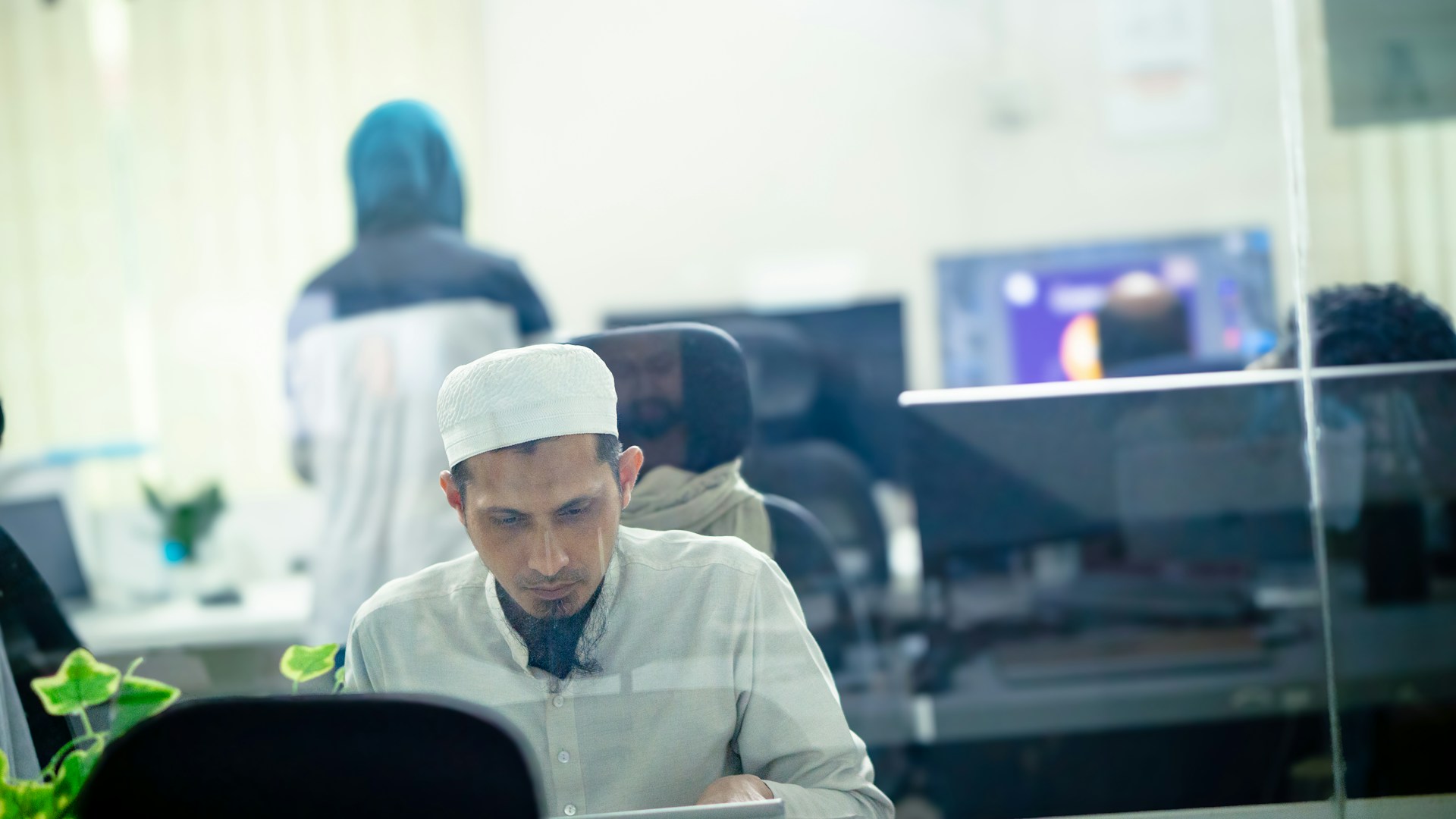 A man sitting at a desk in an office