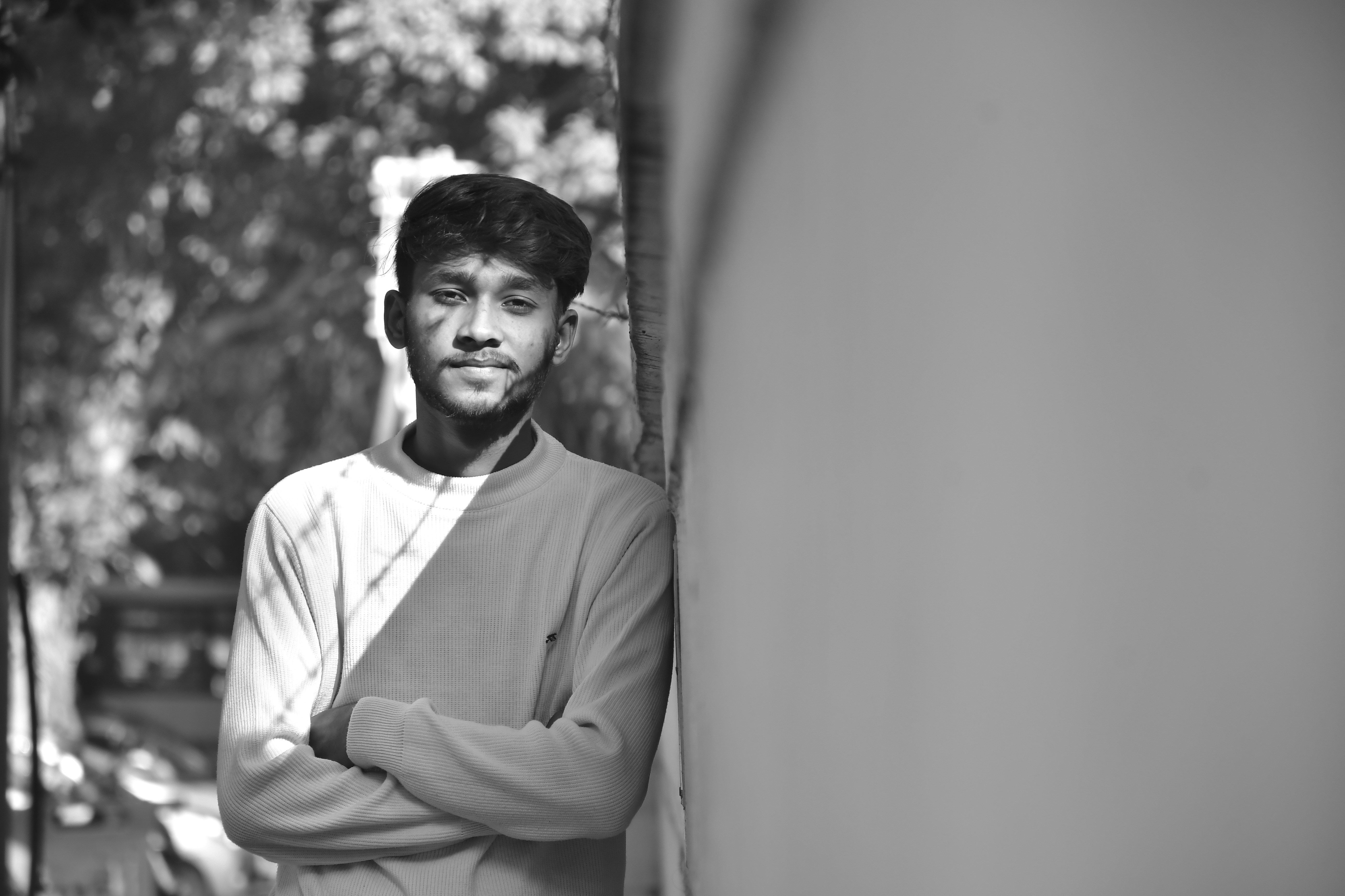 Man leaning against wall