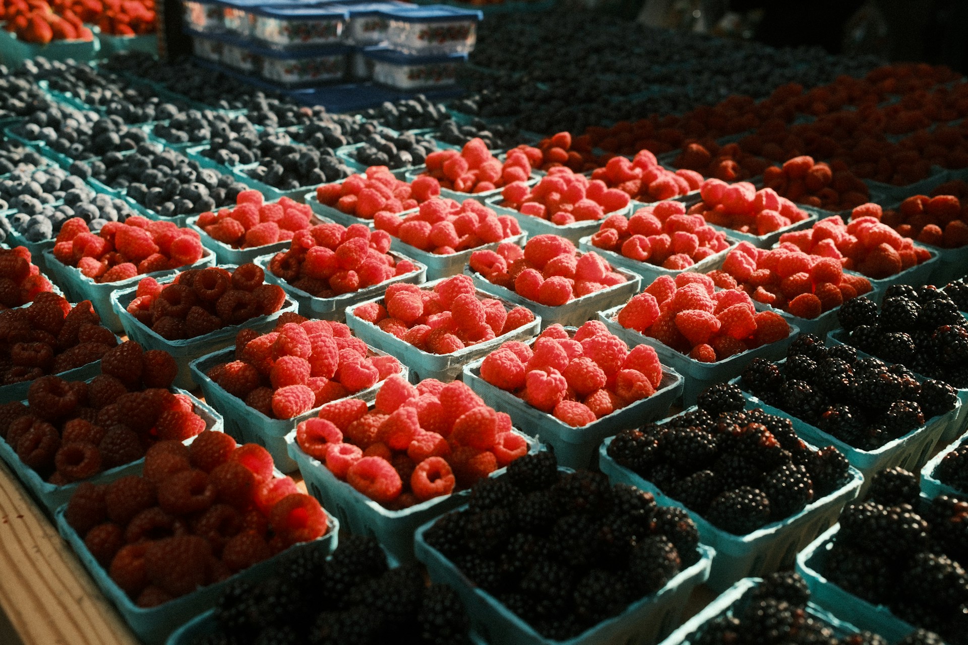 A display of chocolate covered strawberries and strawberries