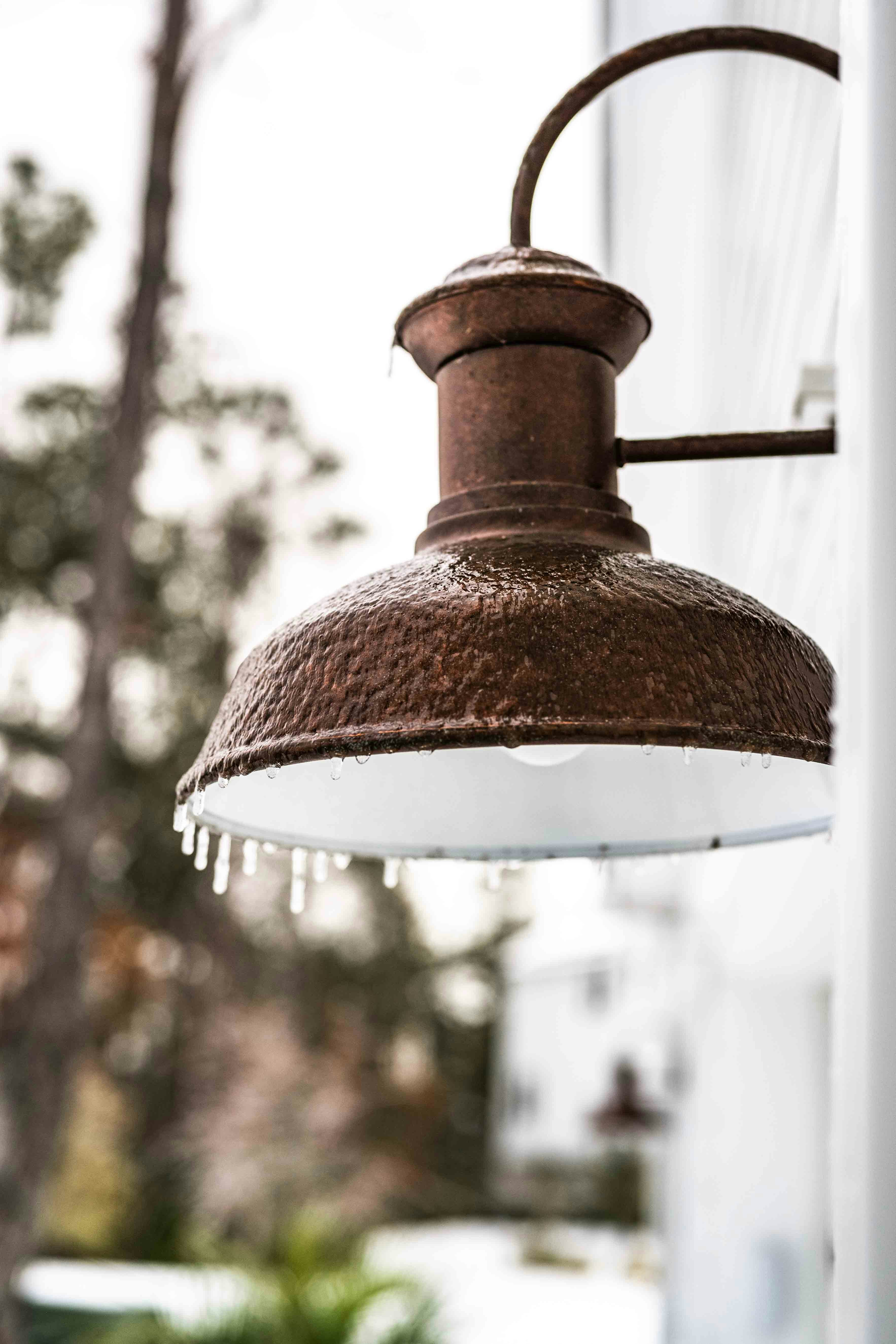 A light hanging from the side of a building